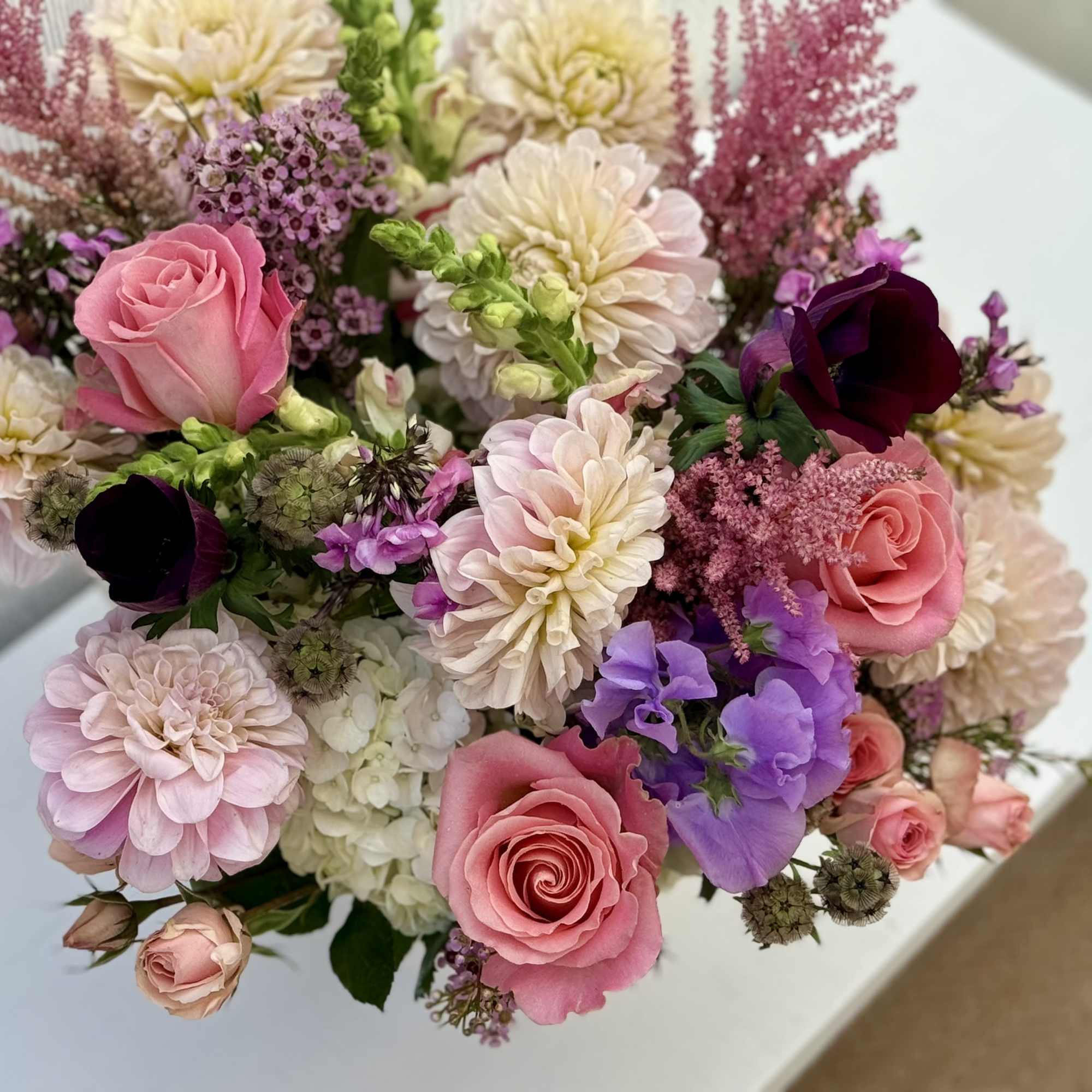 This beautiful design is full of in season dahlias, roses, spray roses