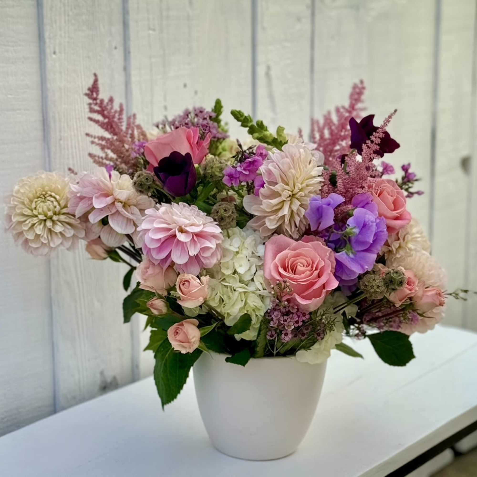 This beautiful design is full of in season dahlias, roses, spray roses