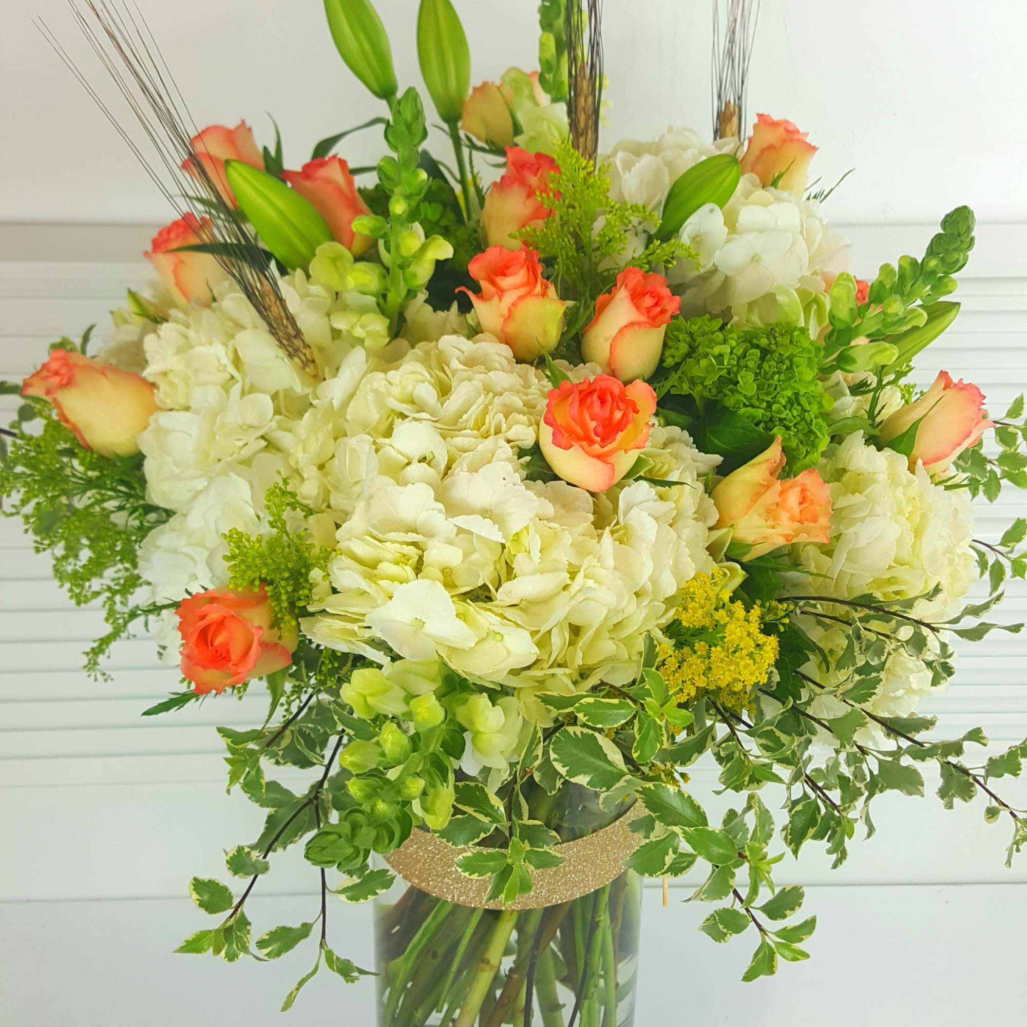 Impressive tall arrangement in a 16&quot; cylinder clear vase field with white
