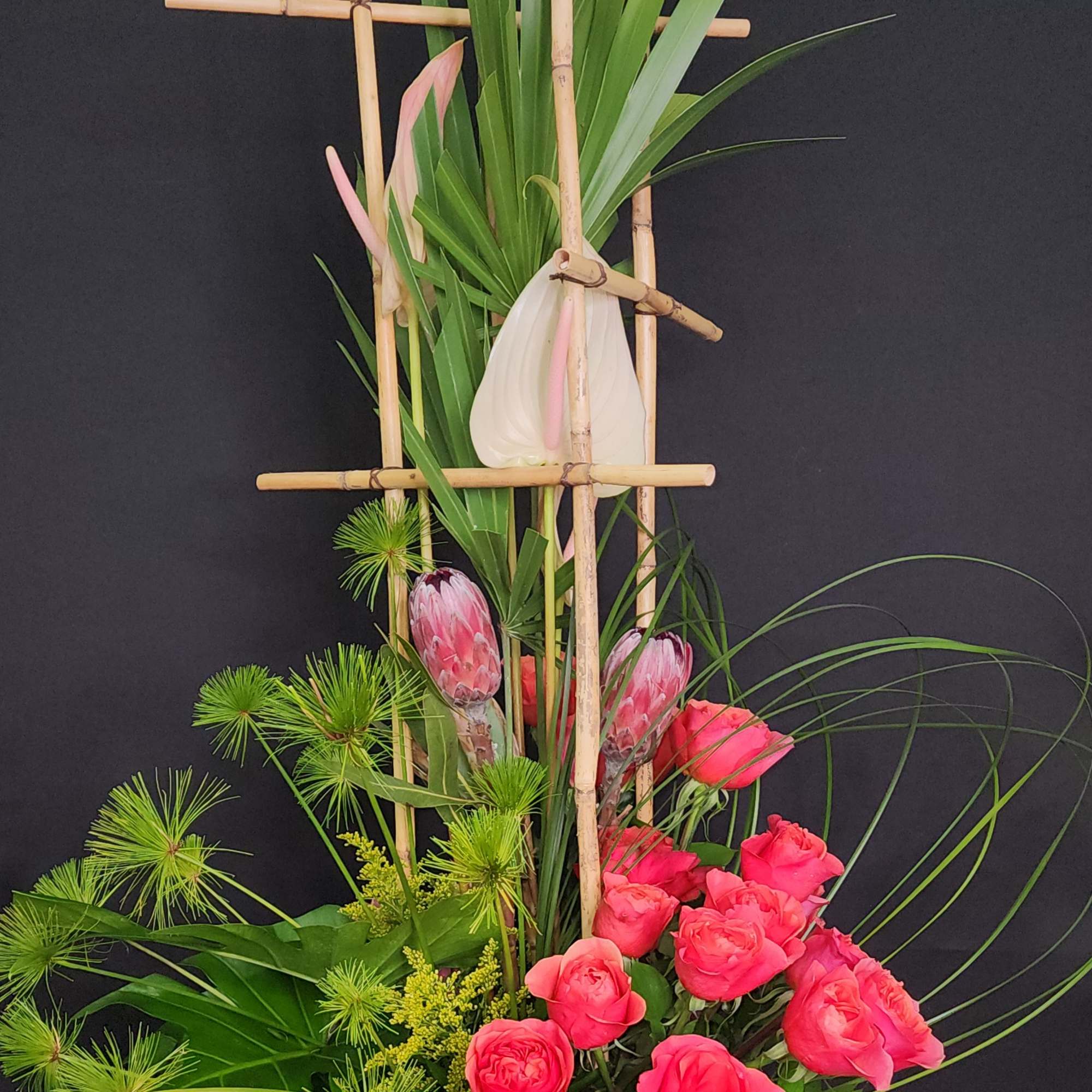 Protea on a bed of roses sets the tone for this powerhouse! Protea on a bed of roses sets the tone for this powerhouse!