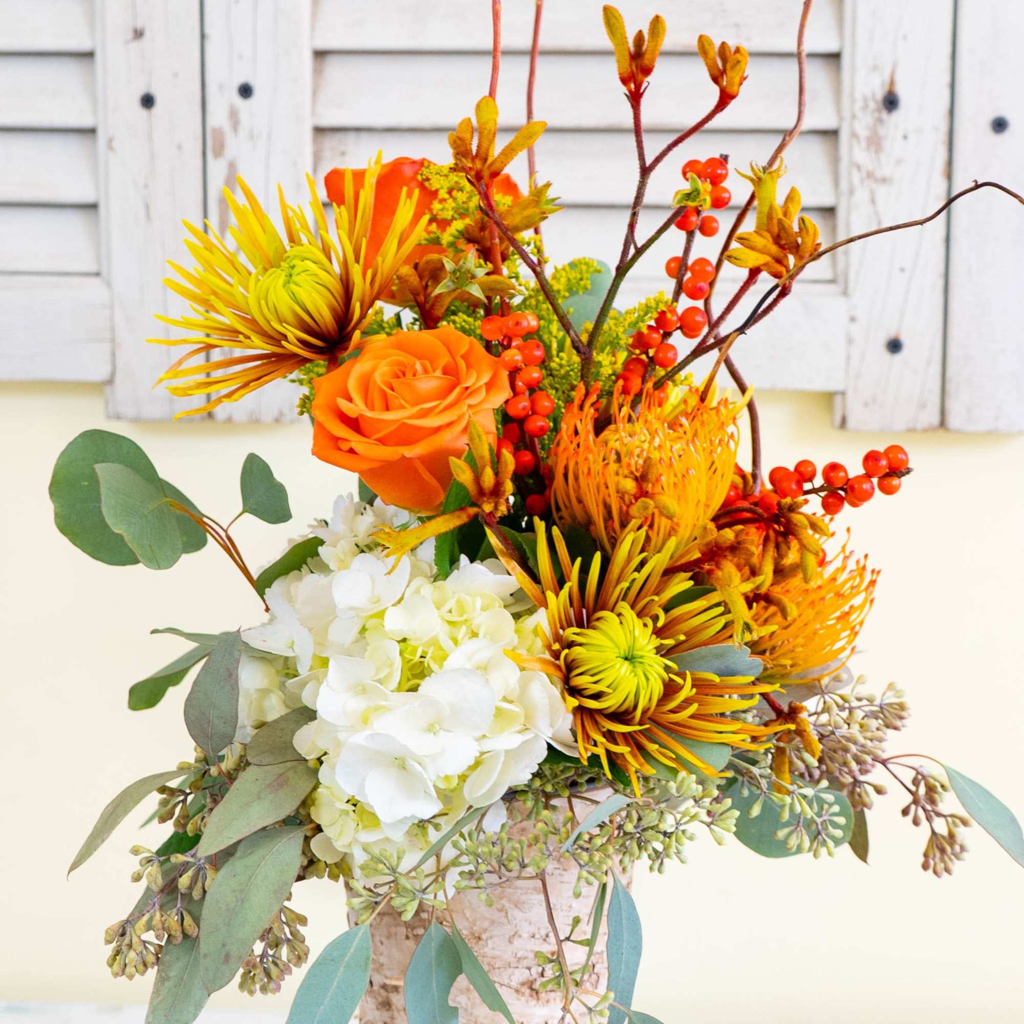 Featured in an 8-inch tall birch vase, Birch of Autumn is a