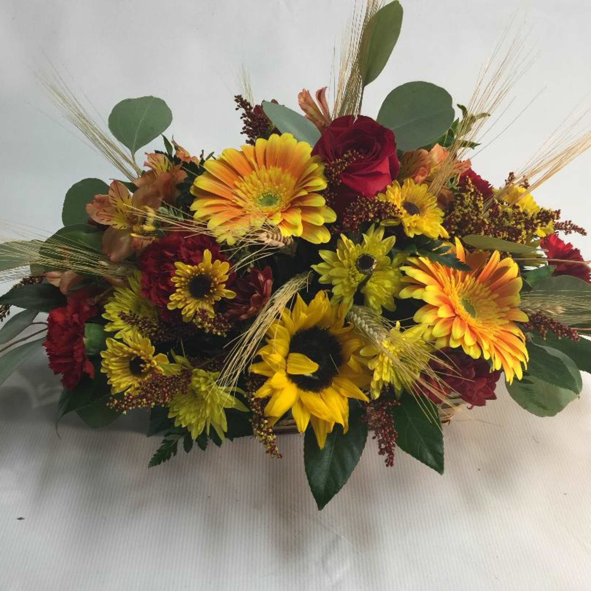 Our Autumn-inspired arrangement captures fall&rsquo;s unique, vibrant beauty. it&rsquo;s loosely gathered for
