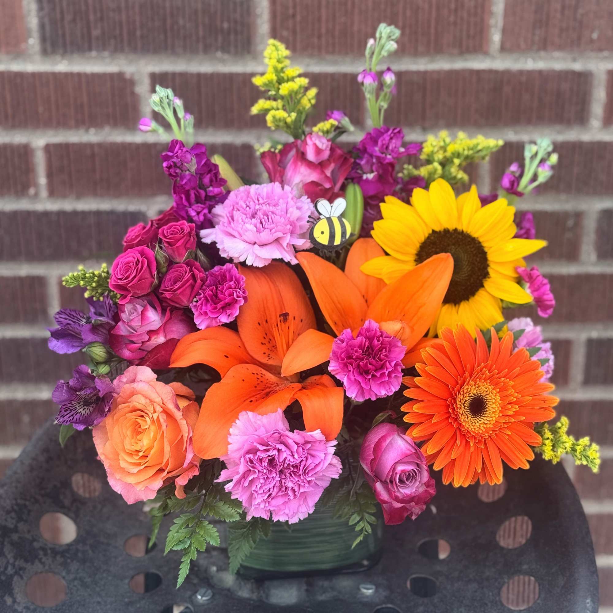 In vibrant tones of orange, yellow and purples/hot pinks and featuring cute In vibrant tones of orange, yellow and purples/hot pinks and featuring cute
