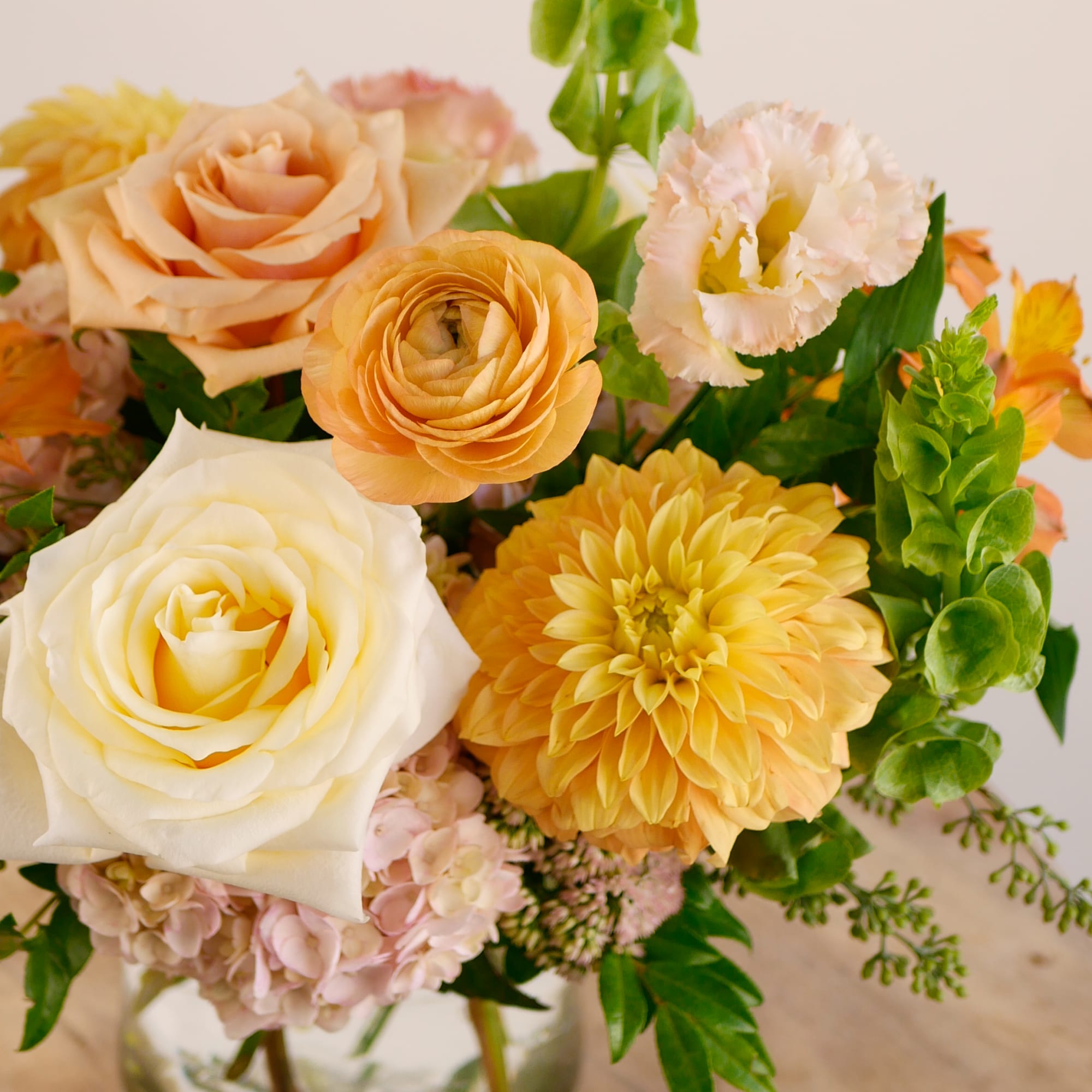 Brighten any space with our Golden Hour arrangement! This petite yet lush