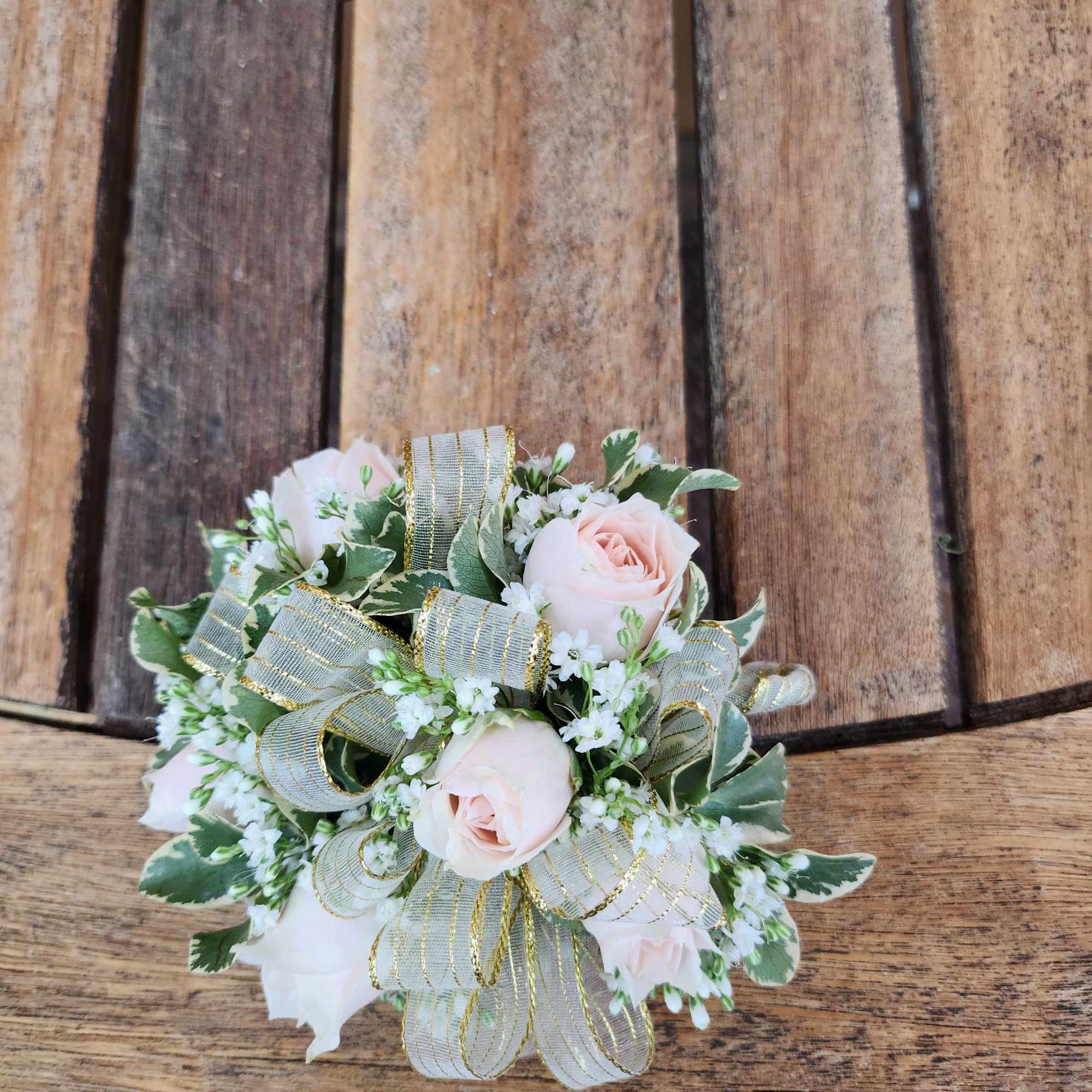 Wrist Corsage With blush spray roses, greenery, filler flower and gold ribbon
