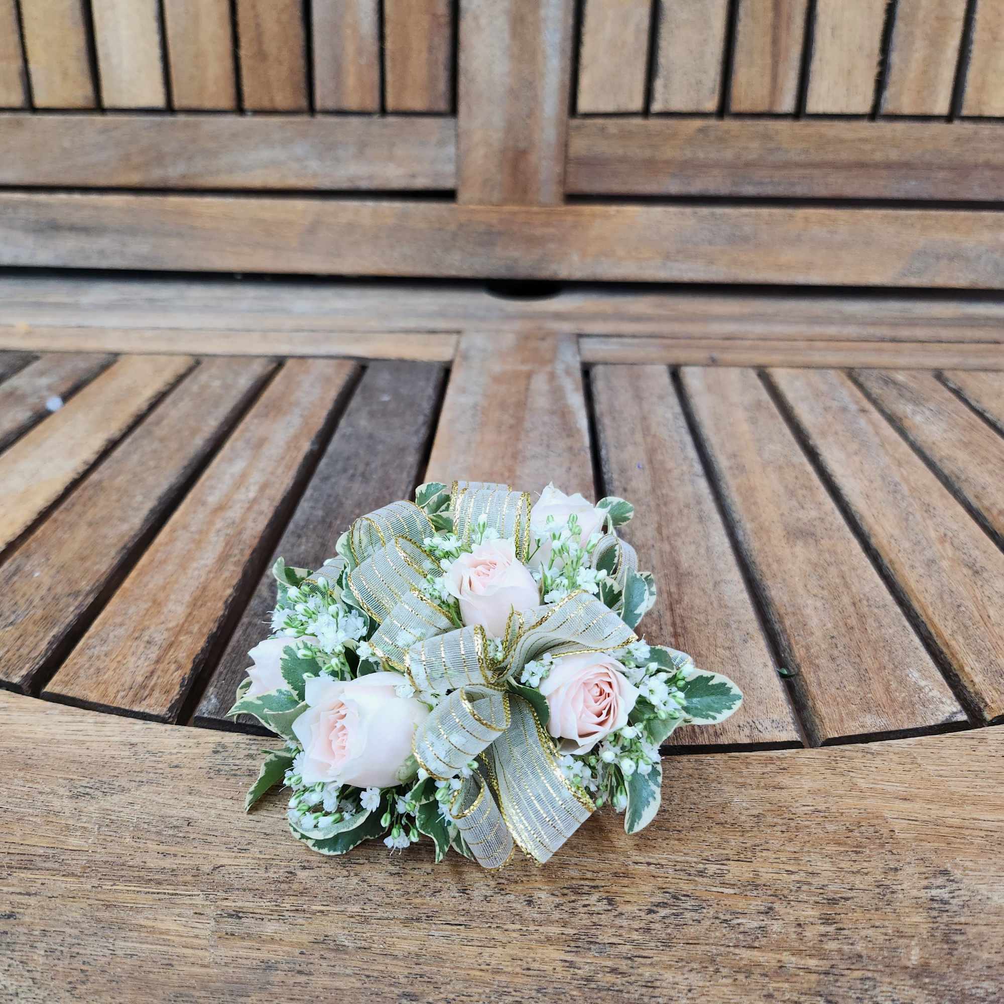 Wrist Corsage With blush spray roses, greenery, filler flower and gold ribbon