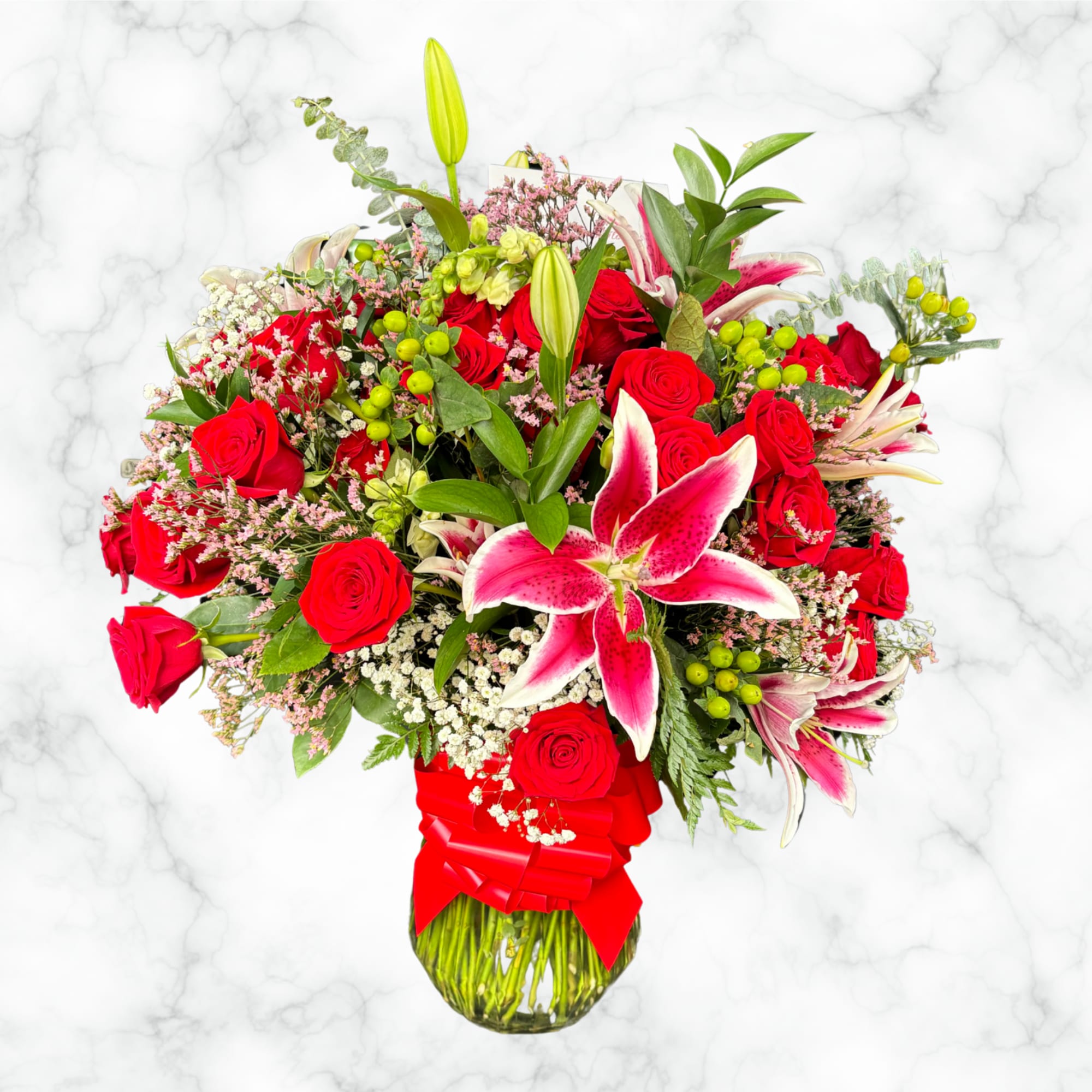 A tropical mix of many different greenery plants and 50 roses

Arrangement you