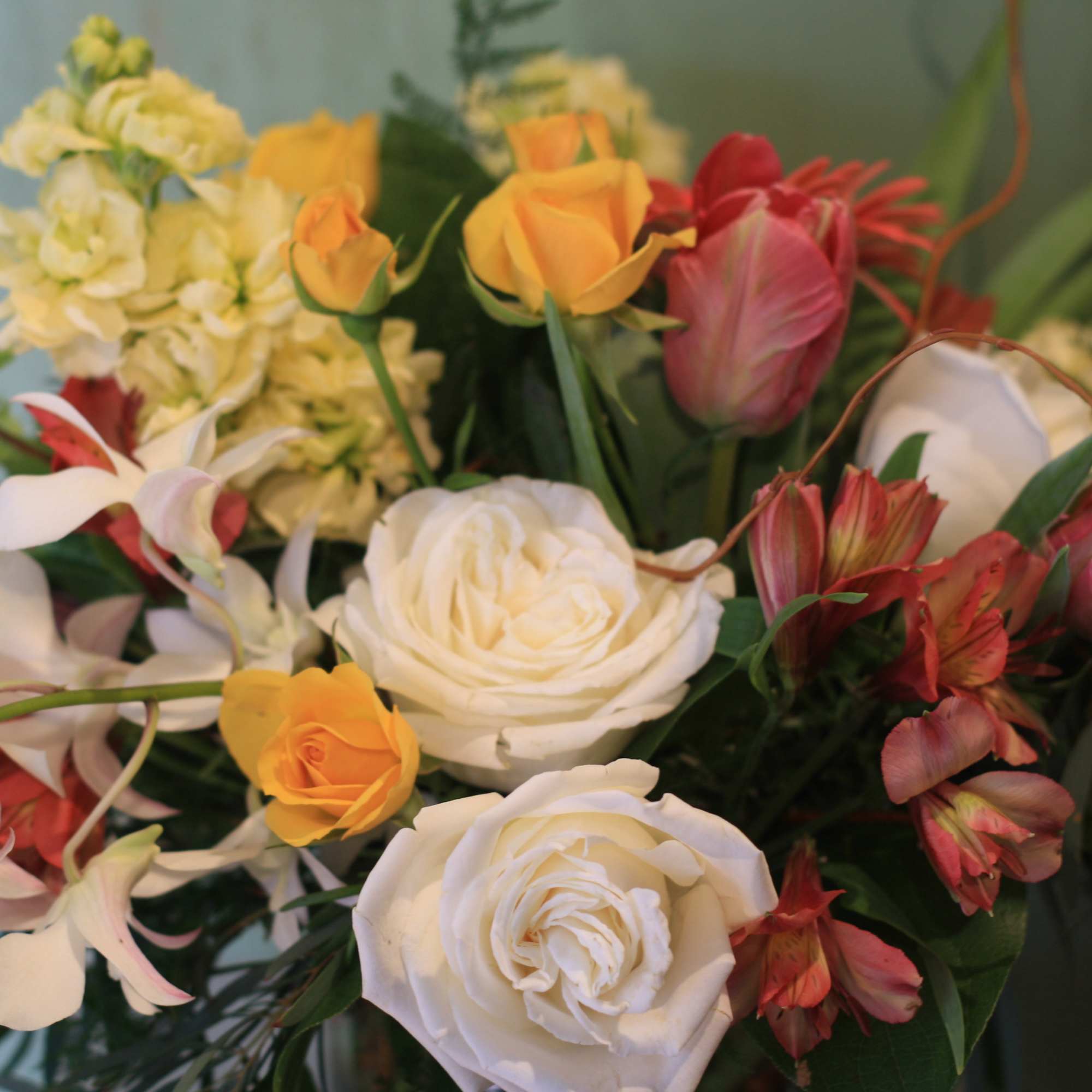 This bright arrangement features an amazing full mix of Roses, Orchids, Gerberas