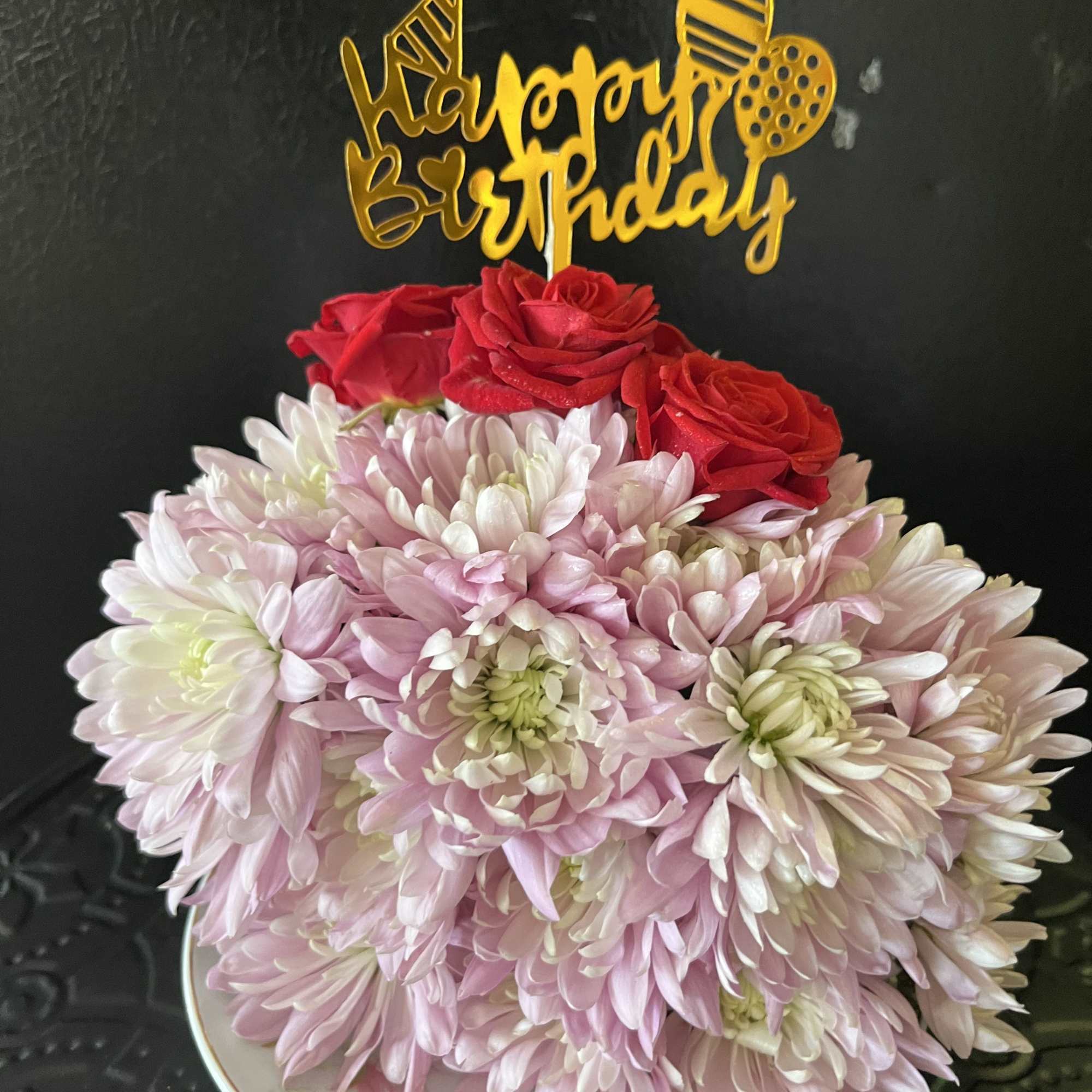 Fresh flowers in a slice of flower cake 