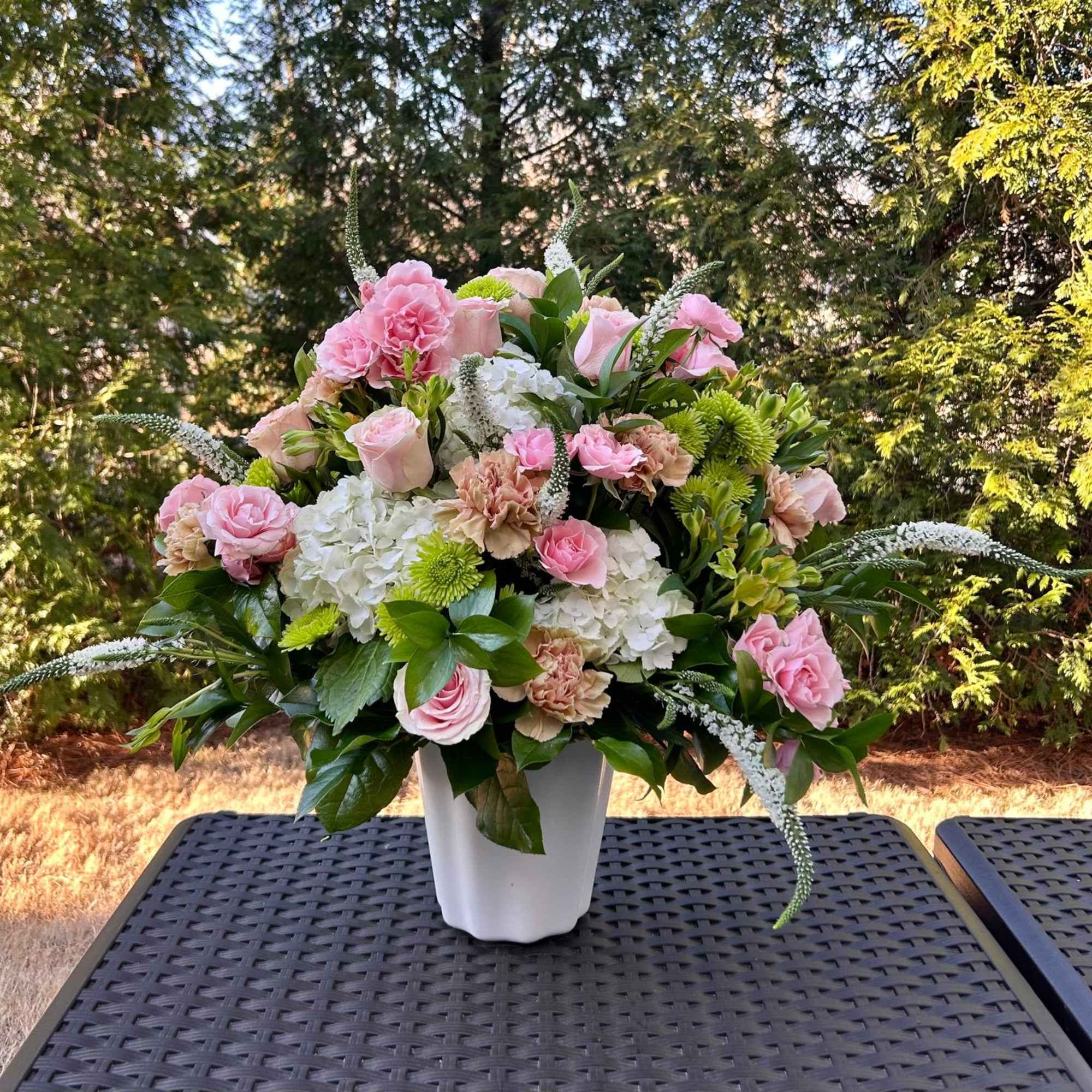 This arrangement is a gentle caress for the eyes and the heart.