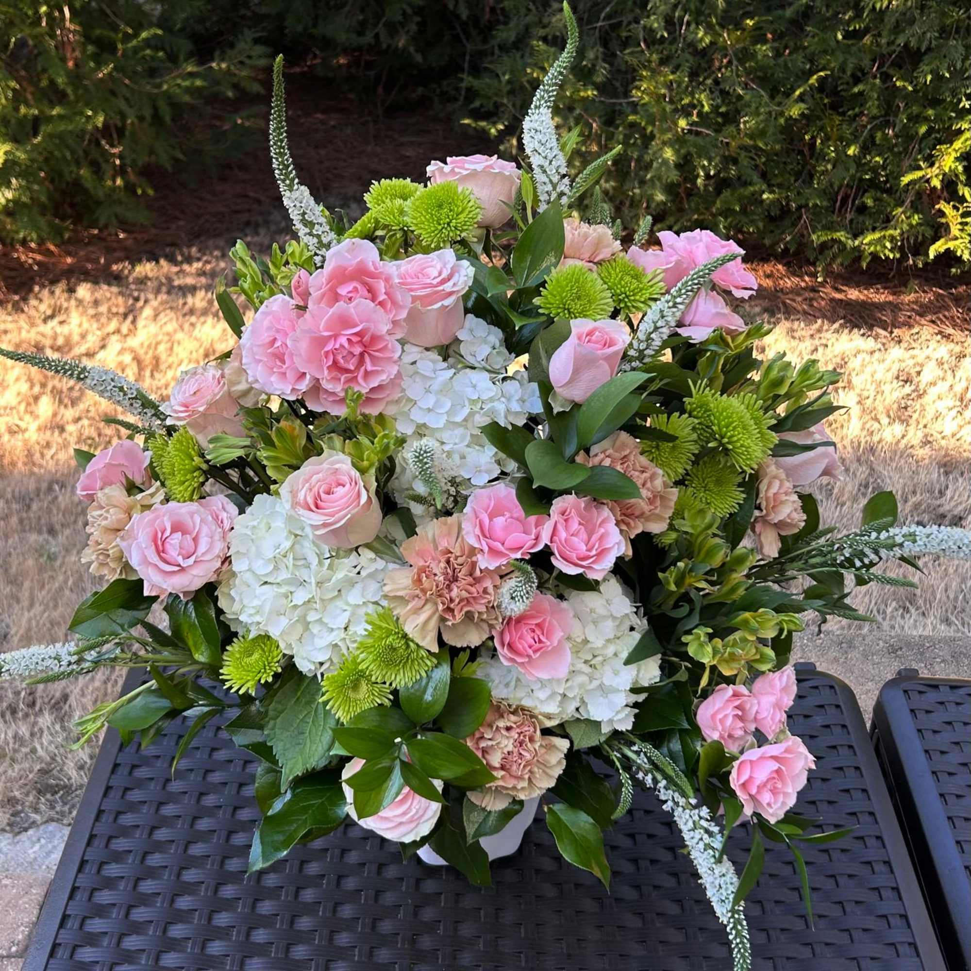 This arrangement is a gentle caress for the eyes and the heart.
