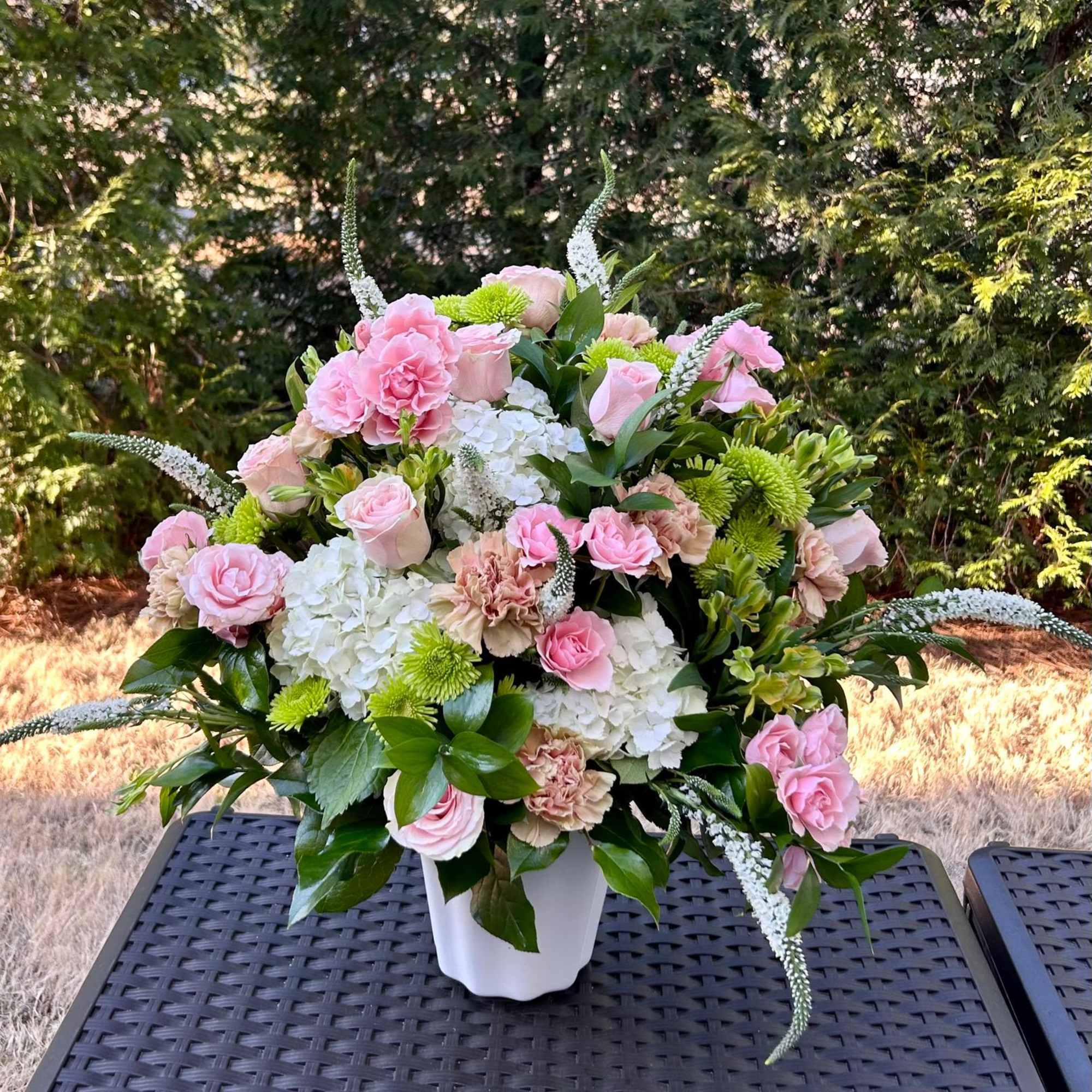 This arrangement is a gentle caress for the eyes and the heart.