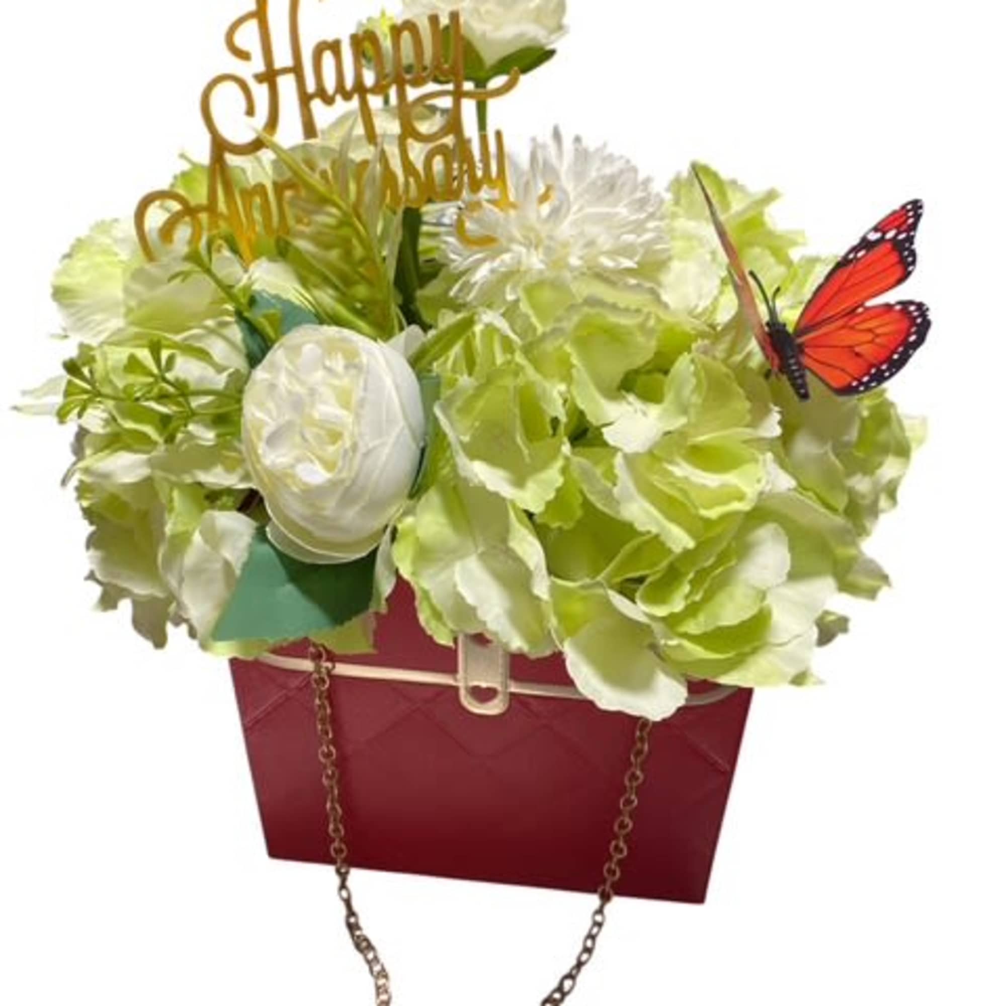 

Description: The &quot;Blooming Elegance Purse&quot; is a stunning silk flower arrangement delicately