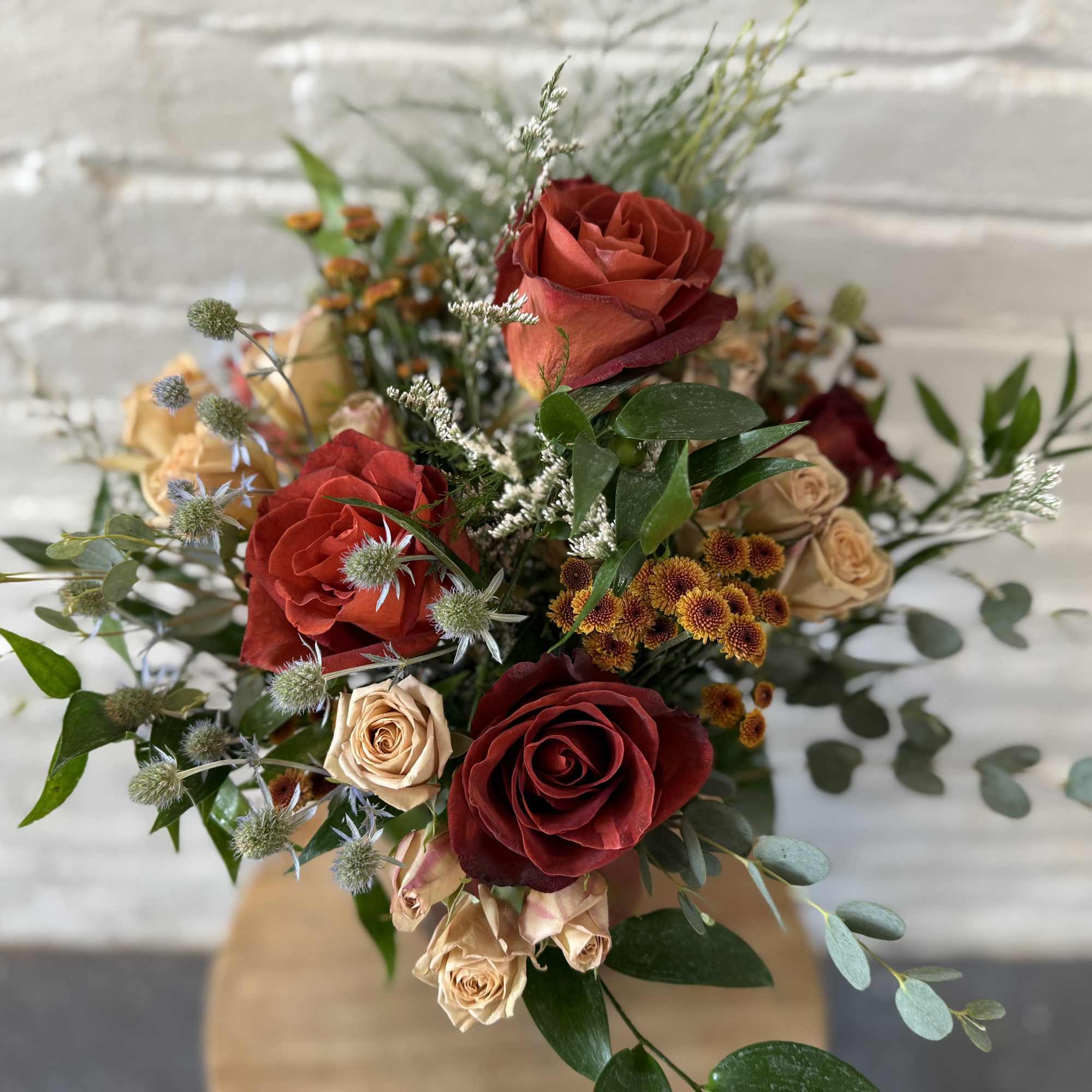 This arrangement will be a wonderful mix of fall colors and textures.
