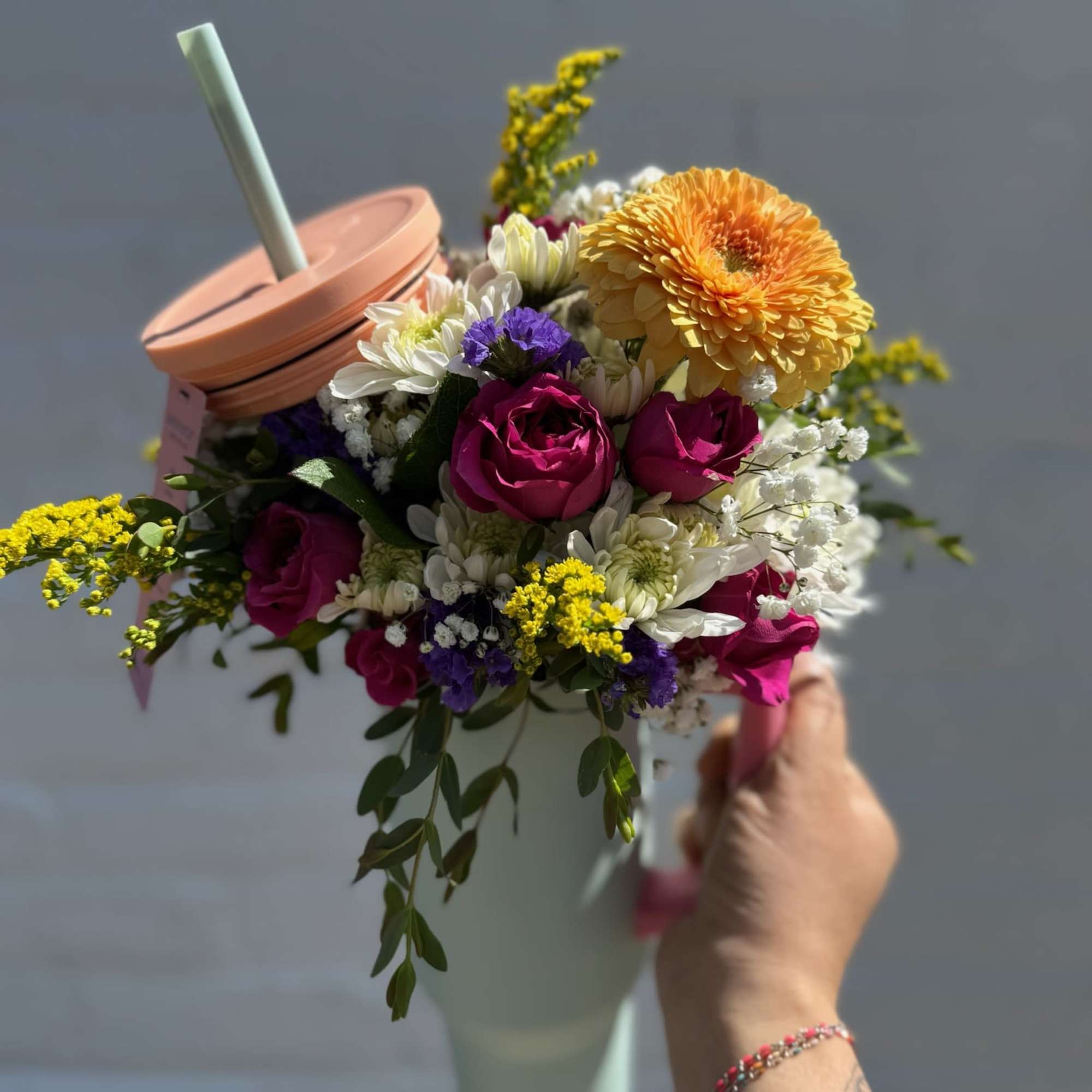 40 oz. tumbler filled with a mix of fresh flowers! Each tumbler