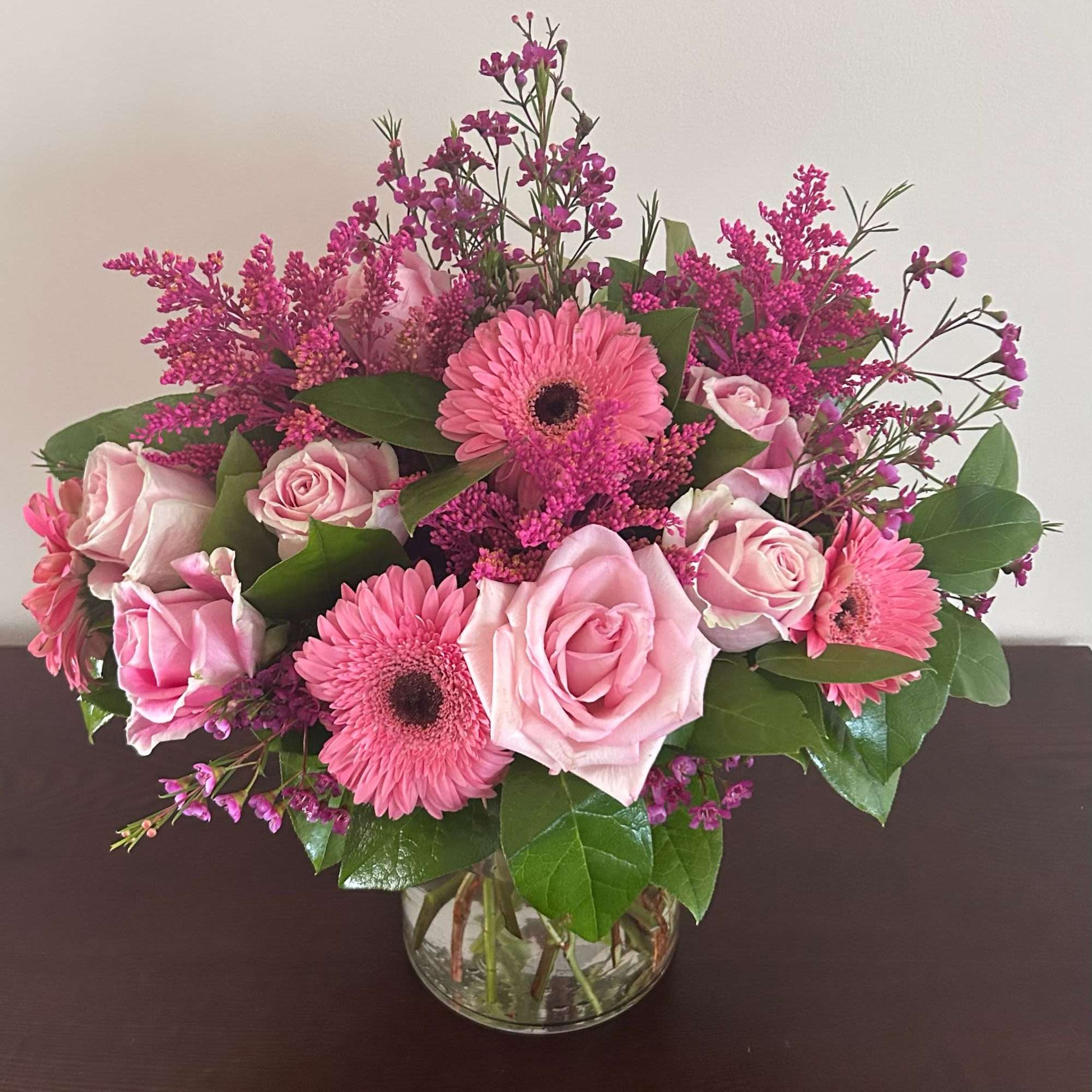 Elegantly crafted with an array of pink and green blooms.
Bloom Details: Gerbera
