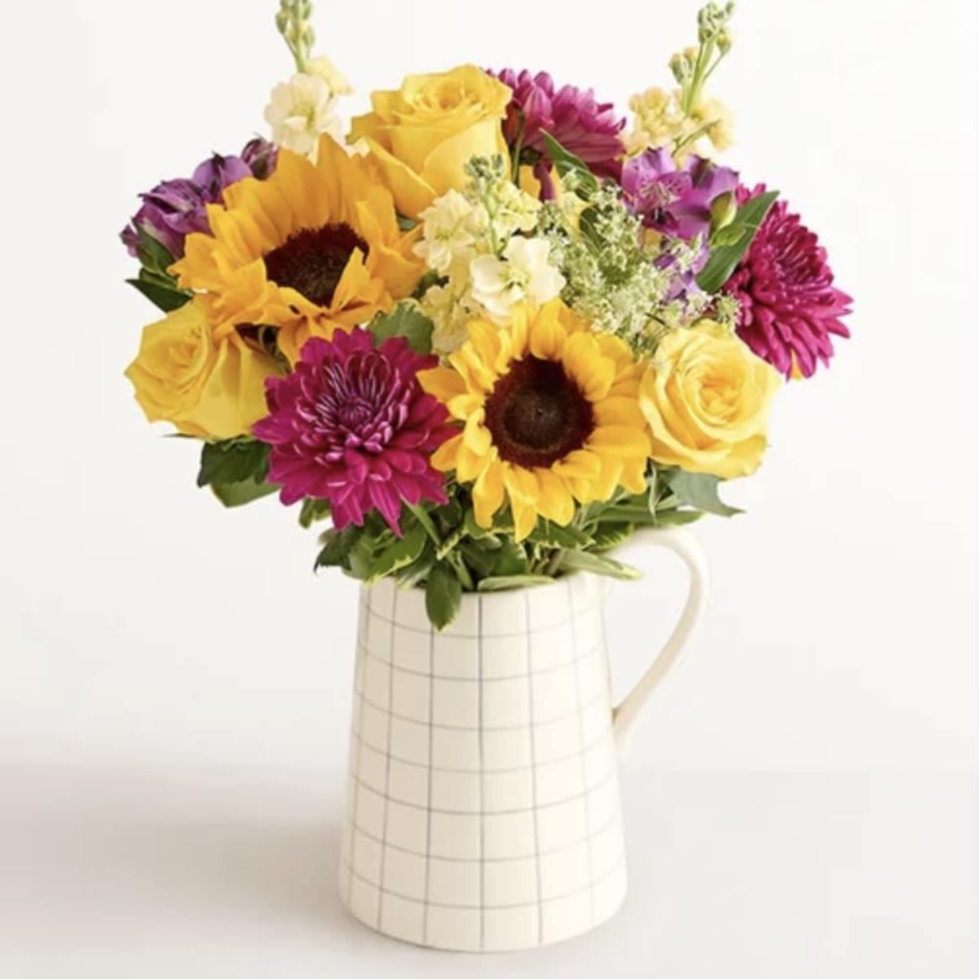 Make someone&rsquo;s day a lot brighter with this mixed arrangement in a