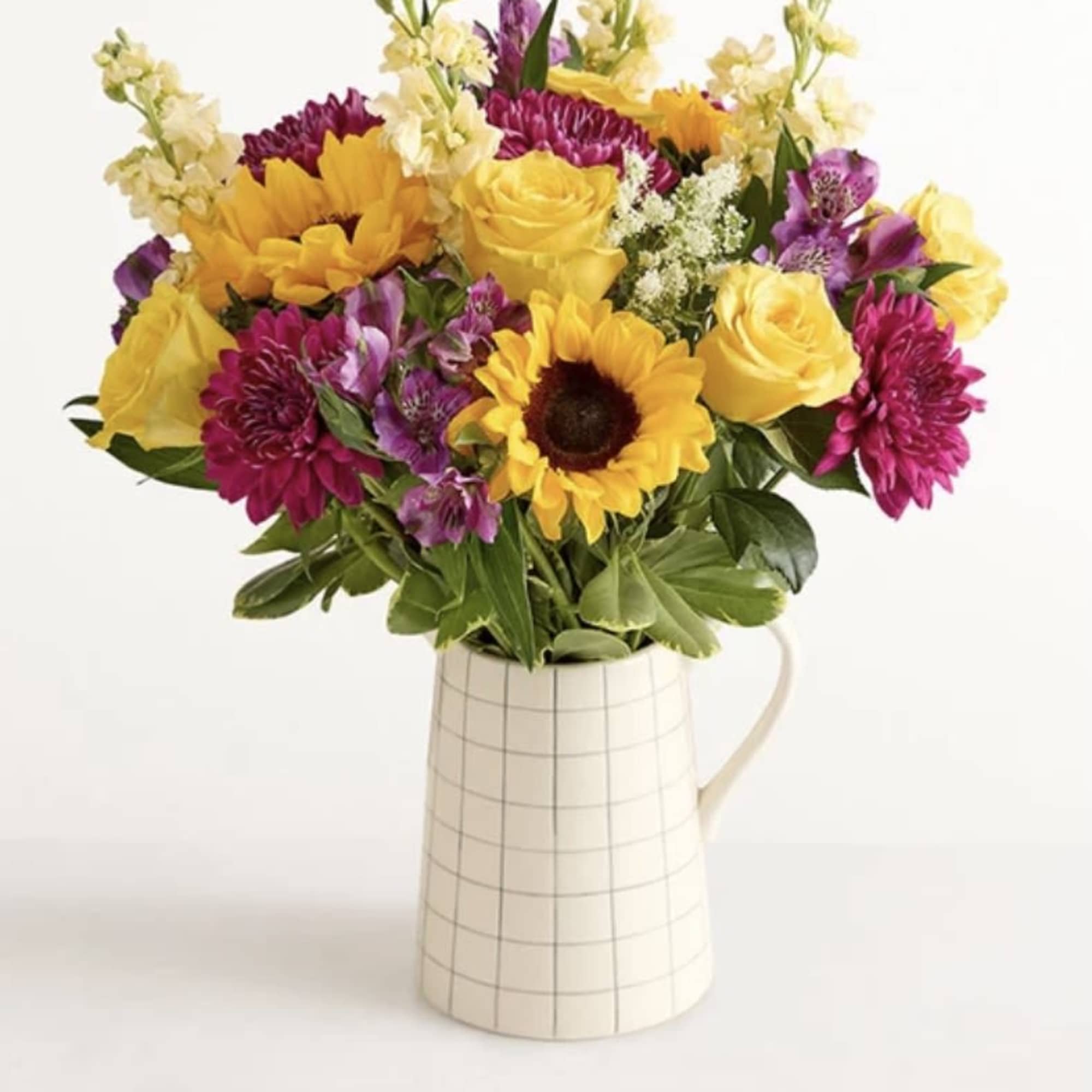 Make someone&rsquo;s day a lot brighter with this mixed arrangement in a