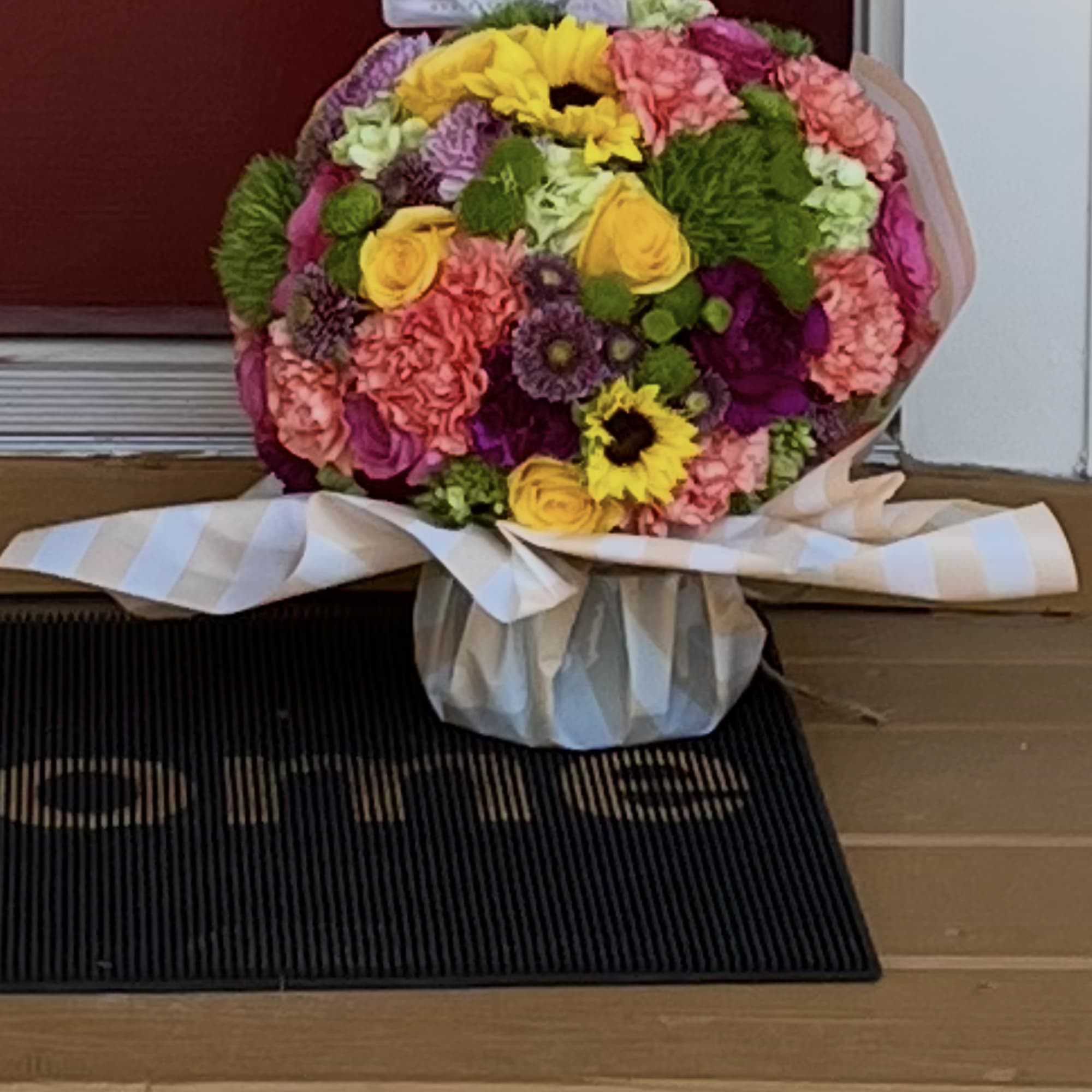 Beautiful bright roses , green hydrangeas, carnations and spray roses along with