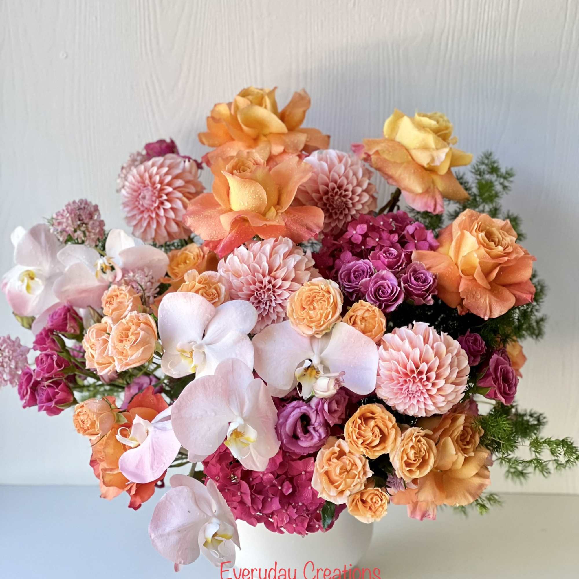 Elevate any occasion with this radiant floral masterpiece, designed to infuse every