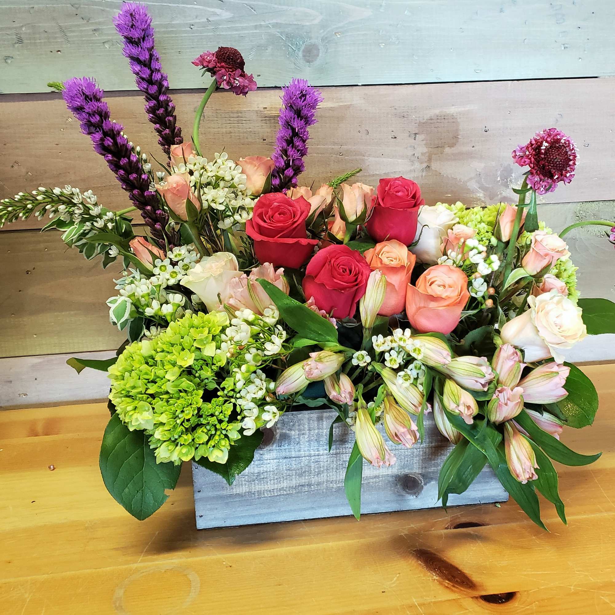 A box of the freshest garden flowers to brighten your day. Colors