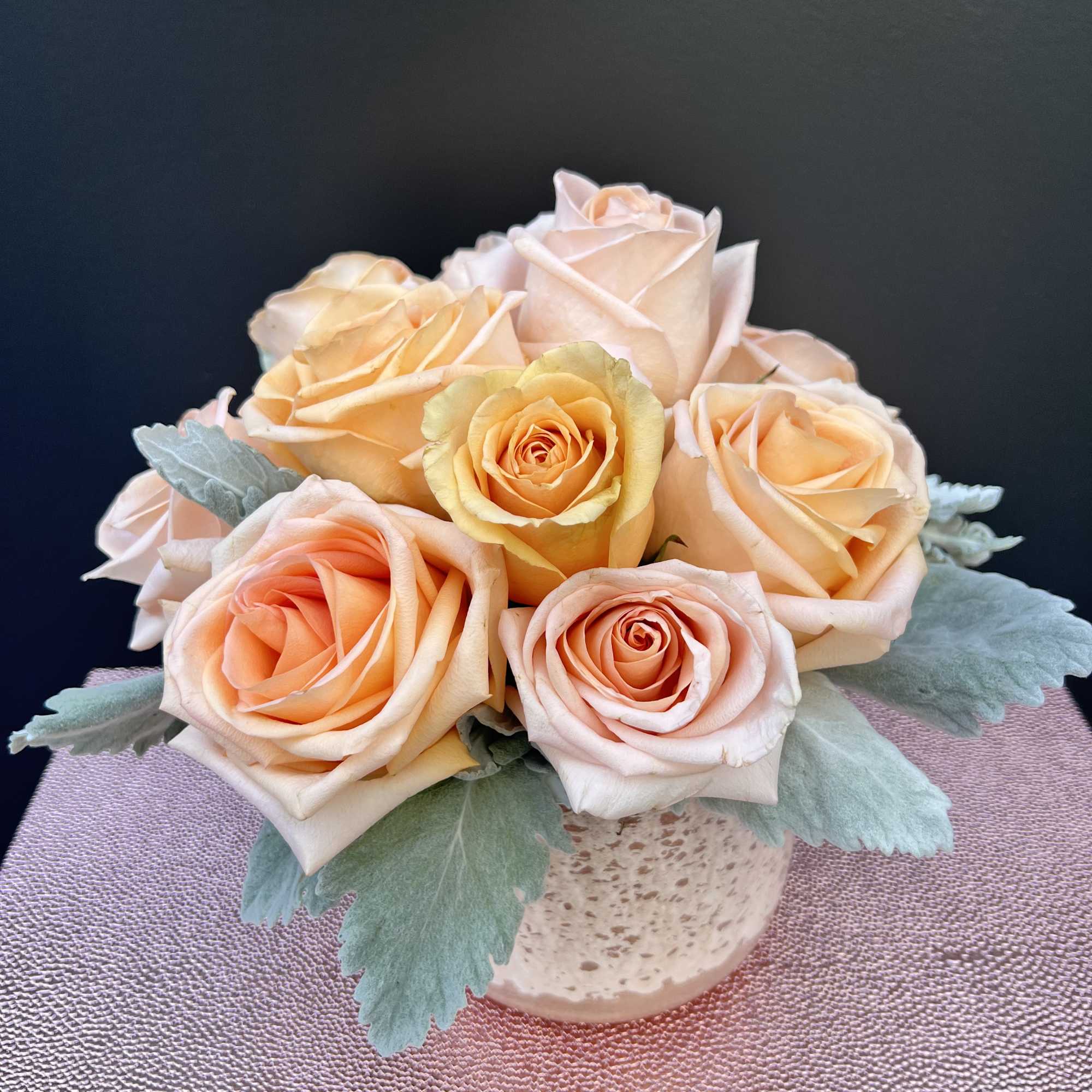 Peach roses are delicate yet charming, making this arrangement elegant and breathe-taking.