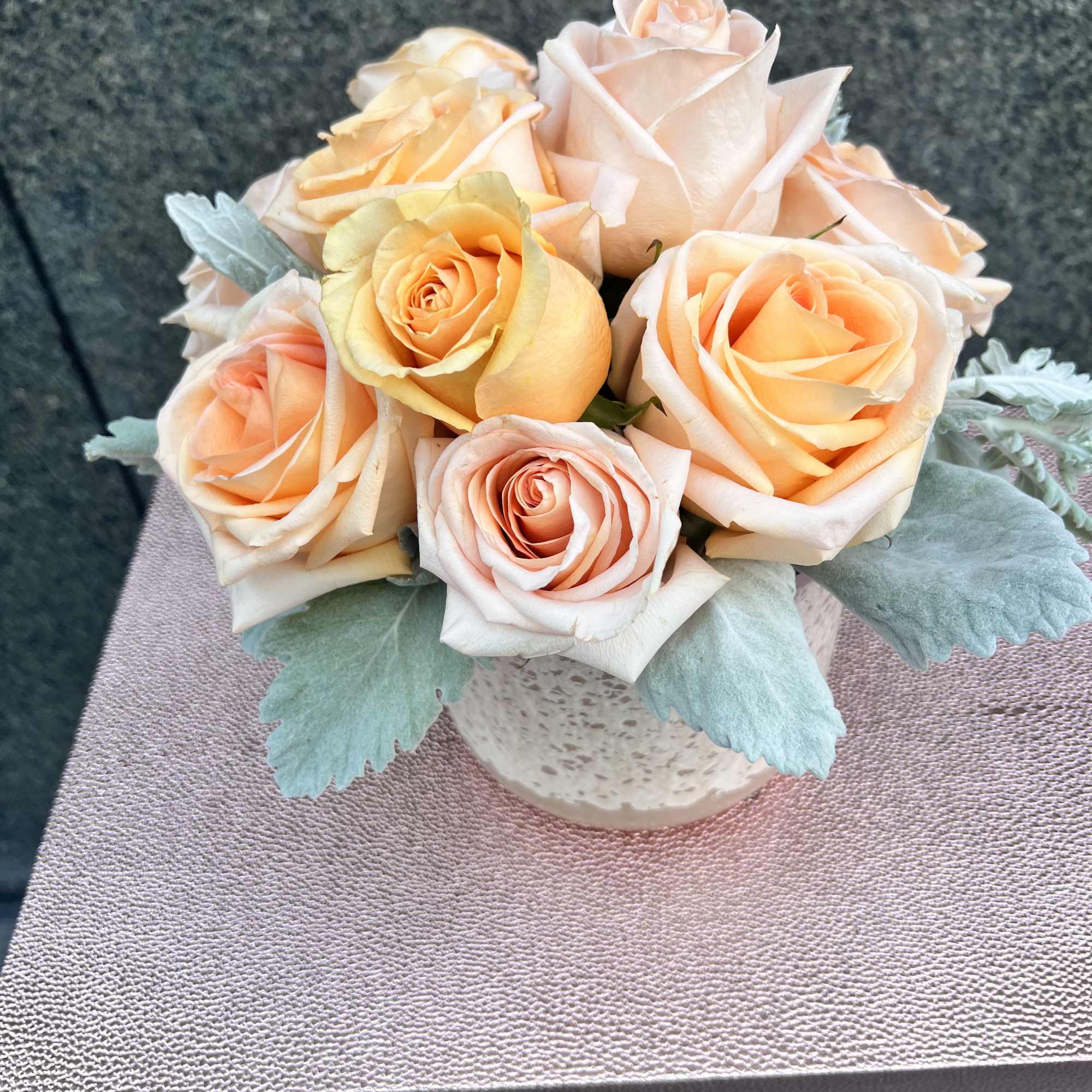 Peach roses are delicate yet charming, making this arrangement elegant and breathe-taking.
