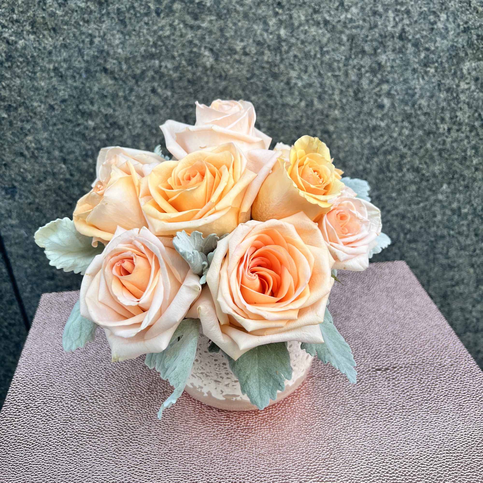 Peach roses are delicate yet charming, making this arrangement elegant and breathe-taking.