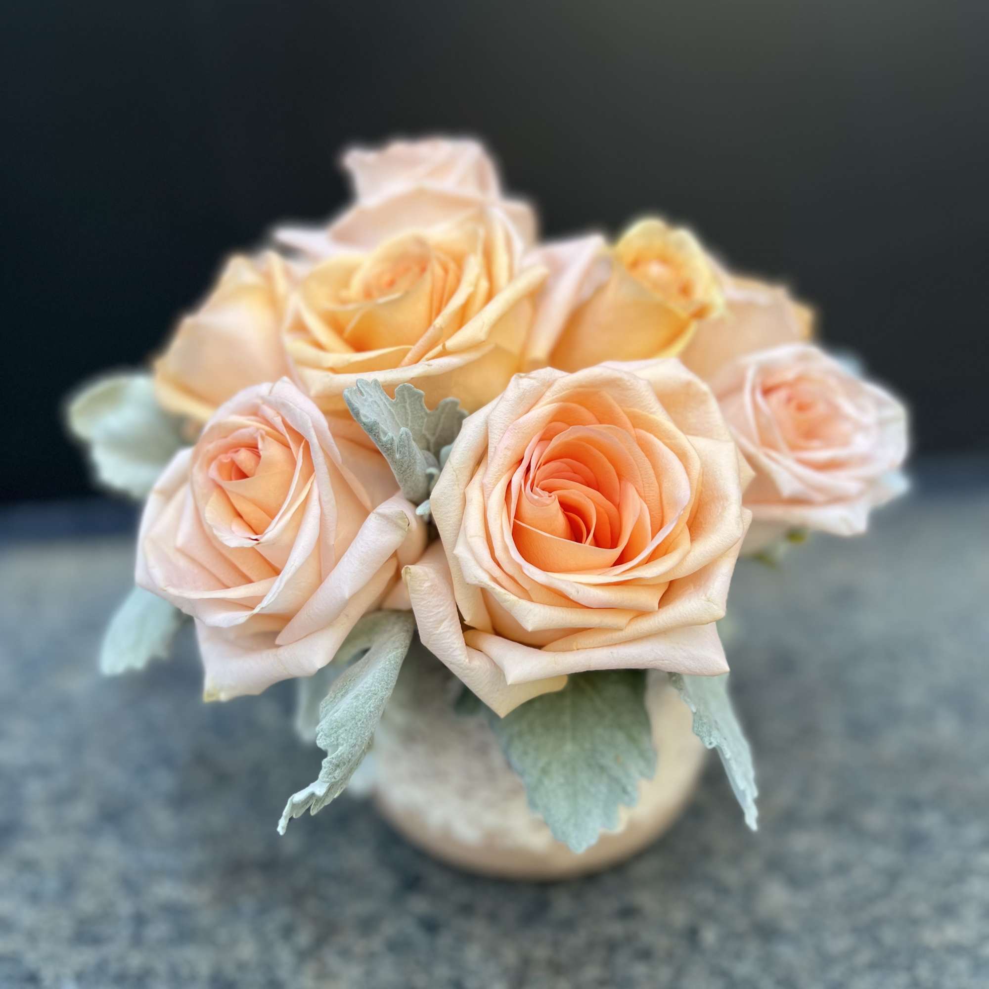 Peach roses are delicate yet charming, making this arrangement elegant and breathe-taking.