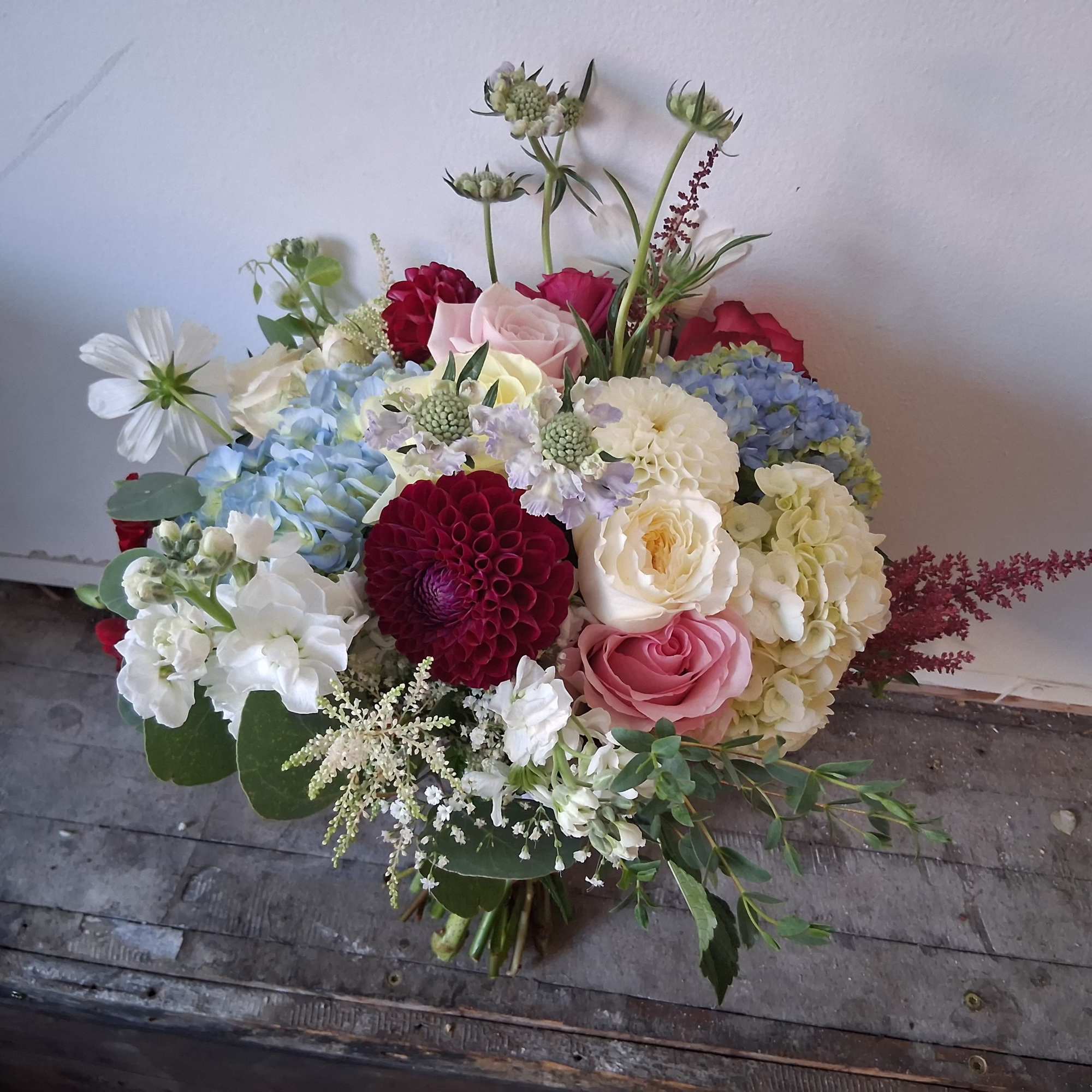 Beautiful vintage style bridal bouquet with white, light pink, light blue and