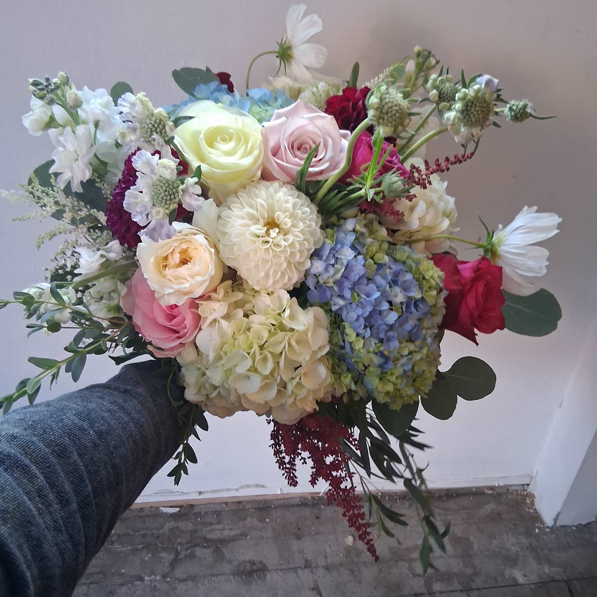 Beautiful vintage style bridal bouquet with white, light pink, light blue and