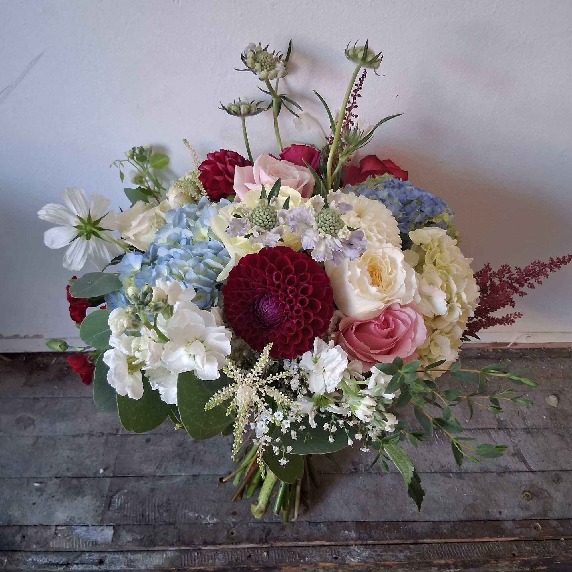 Beautiful vintage style bridal bouquet with white, light pink, light blue and