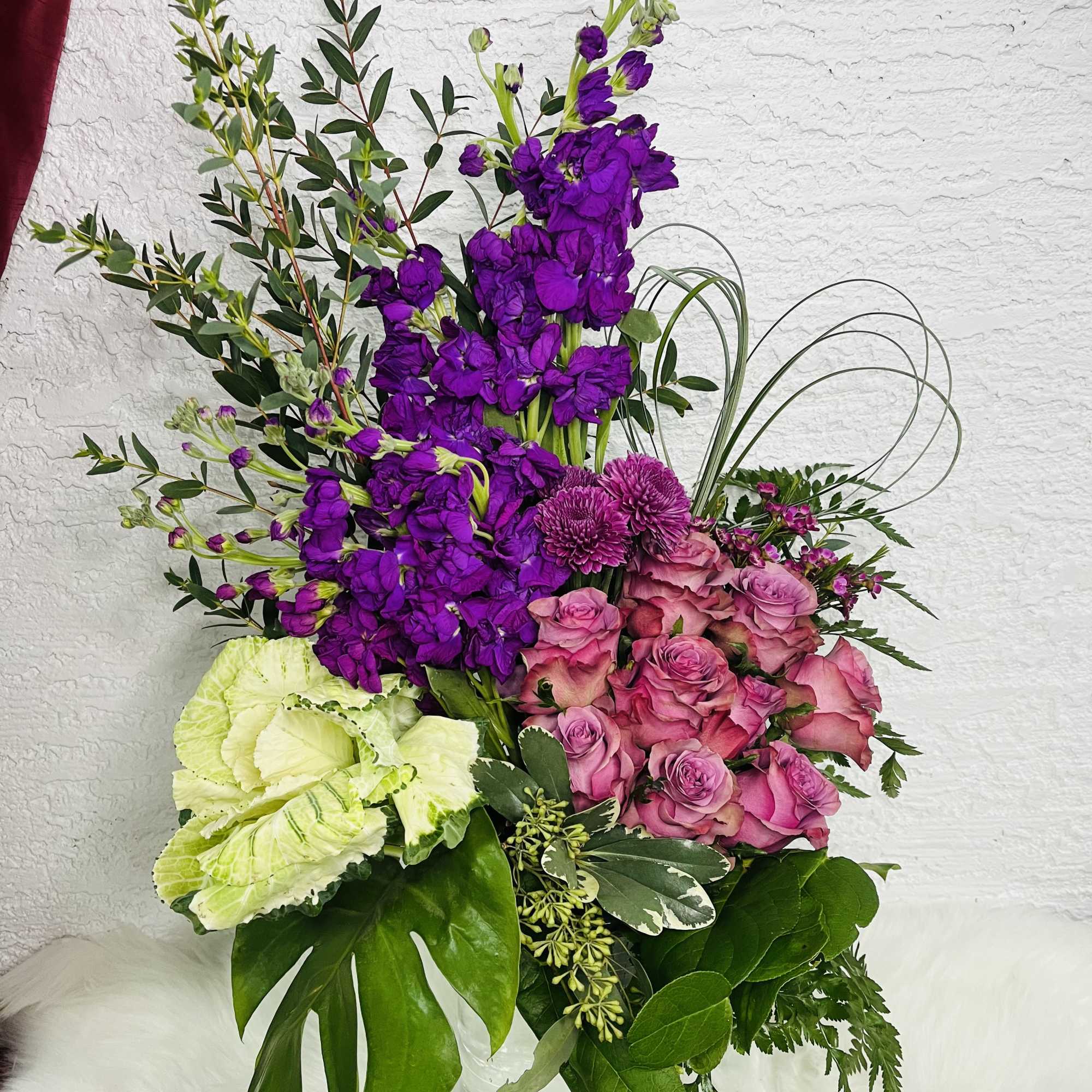 Brighten any room with this vibrant and sophisticated flower arrangement, designed with Brighten any room with this vibrant and sophisticated flower arrangement, designed with