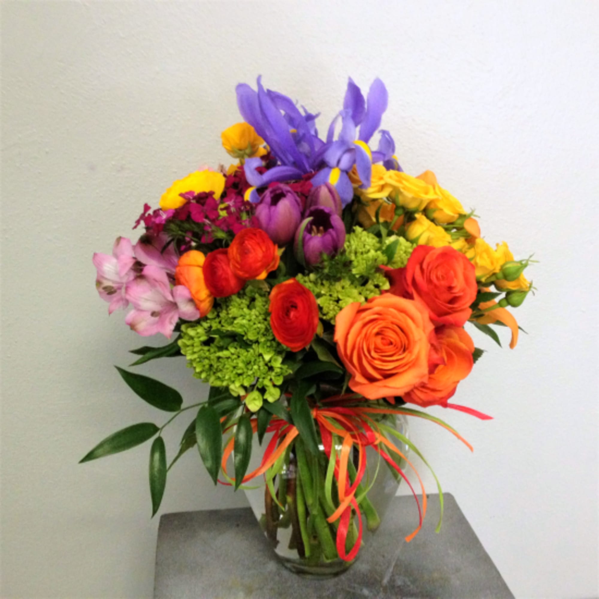 A Burst of Cheer for Any Occasion
Our Bright Blossoms arrangement is a A Burst of Cheer for Any Occasion
Our Bright Blossoms arrangement is a