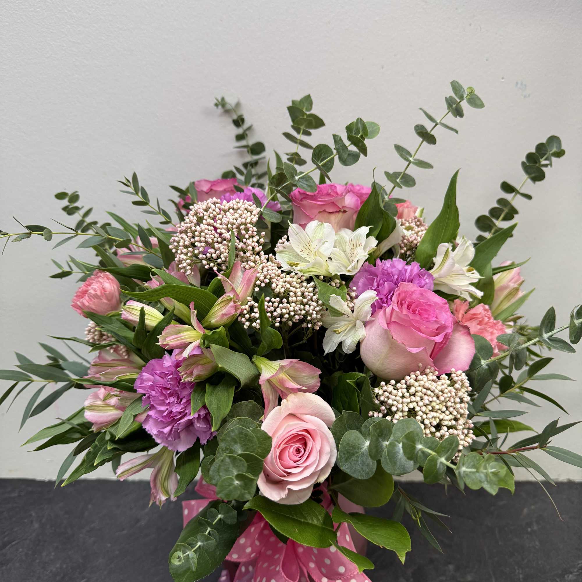 A sweet and cheerful bouquet designed to brighten any day. Featuring soft