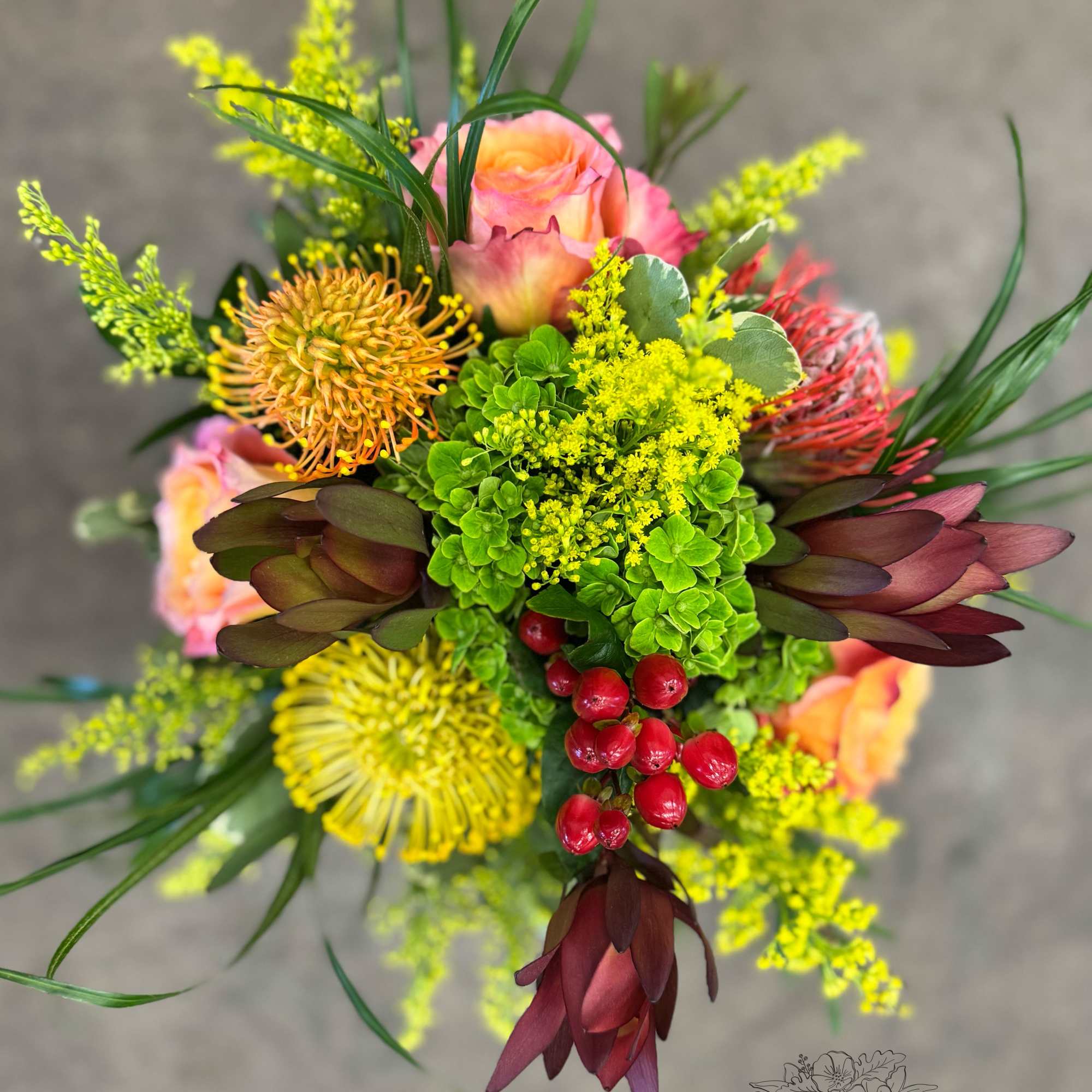 A radiant mix of coral roses, bright green hydrangea, yellow red and A radiant mix of coral roses, bright green hydrangea, yellow red and