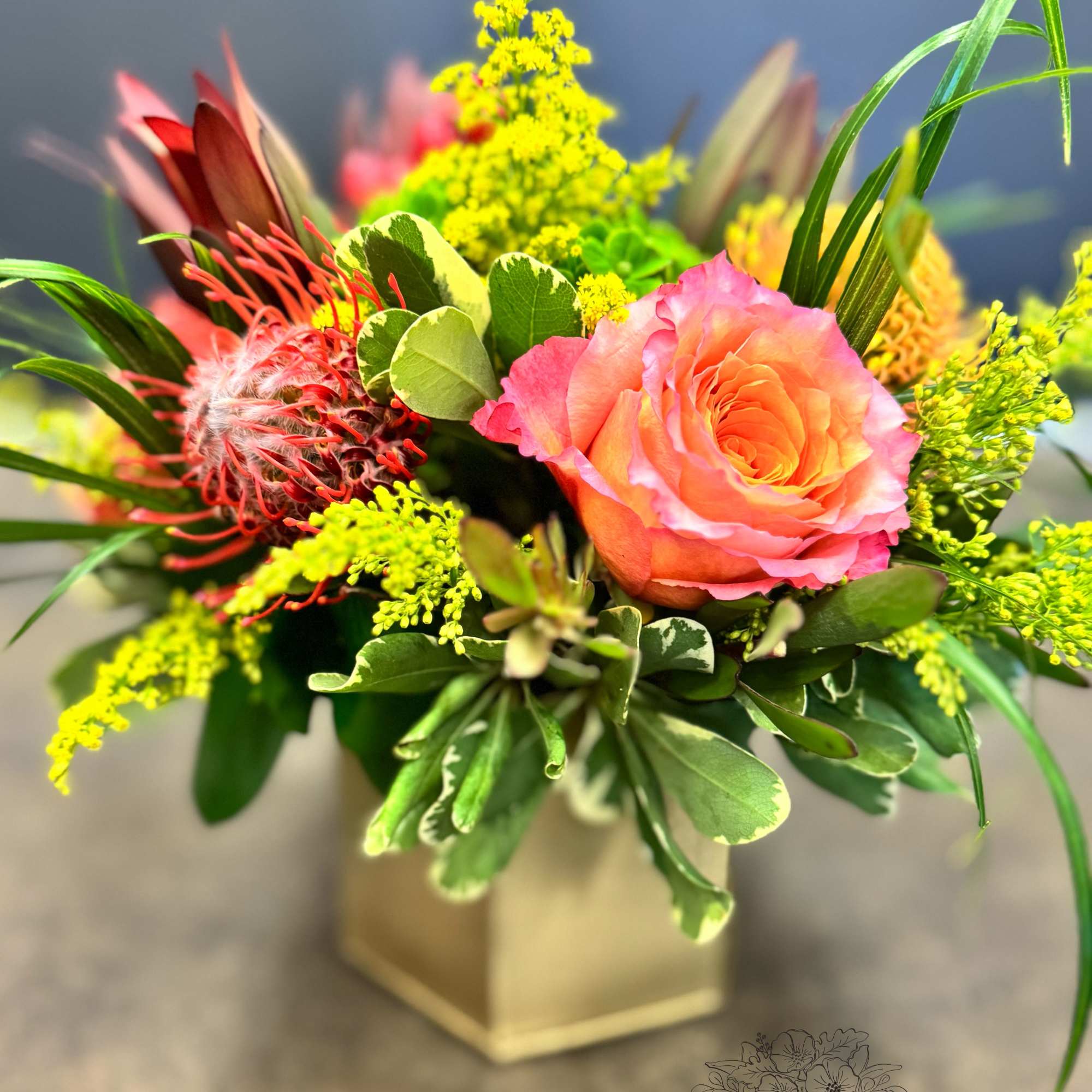 A radiant mix of coral roses, bright green hydrangea, yellow red and A radiant mix of coral roses, bright green hydrangea, yellow red and