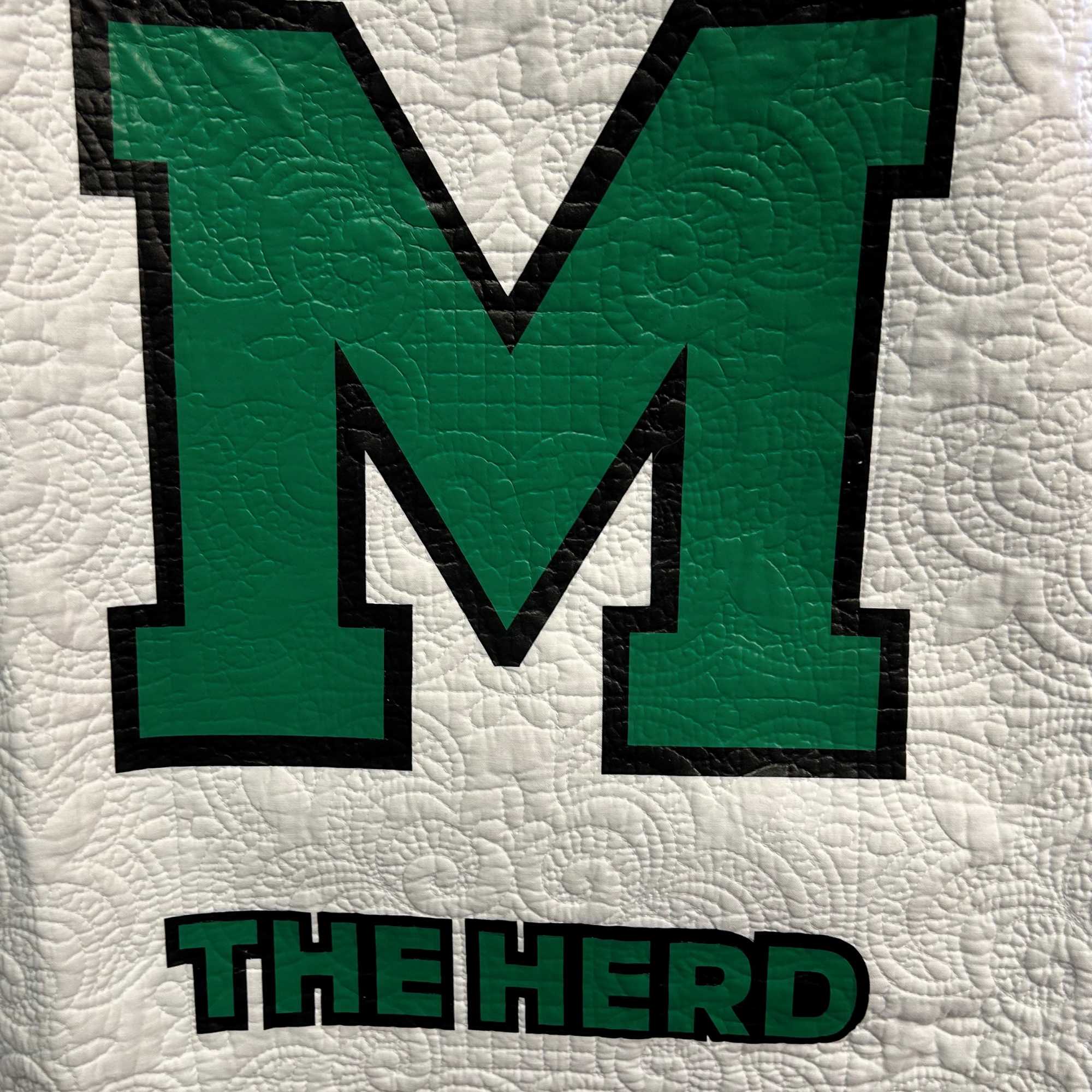 White Scalloped Edge Throw with Green " M " THE HERD Letters. White Scalloped Edge Throw with Green " M " THE HERD Letters.