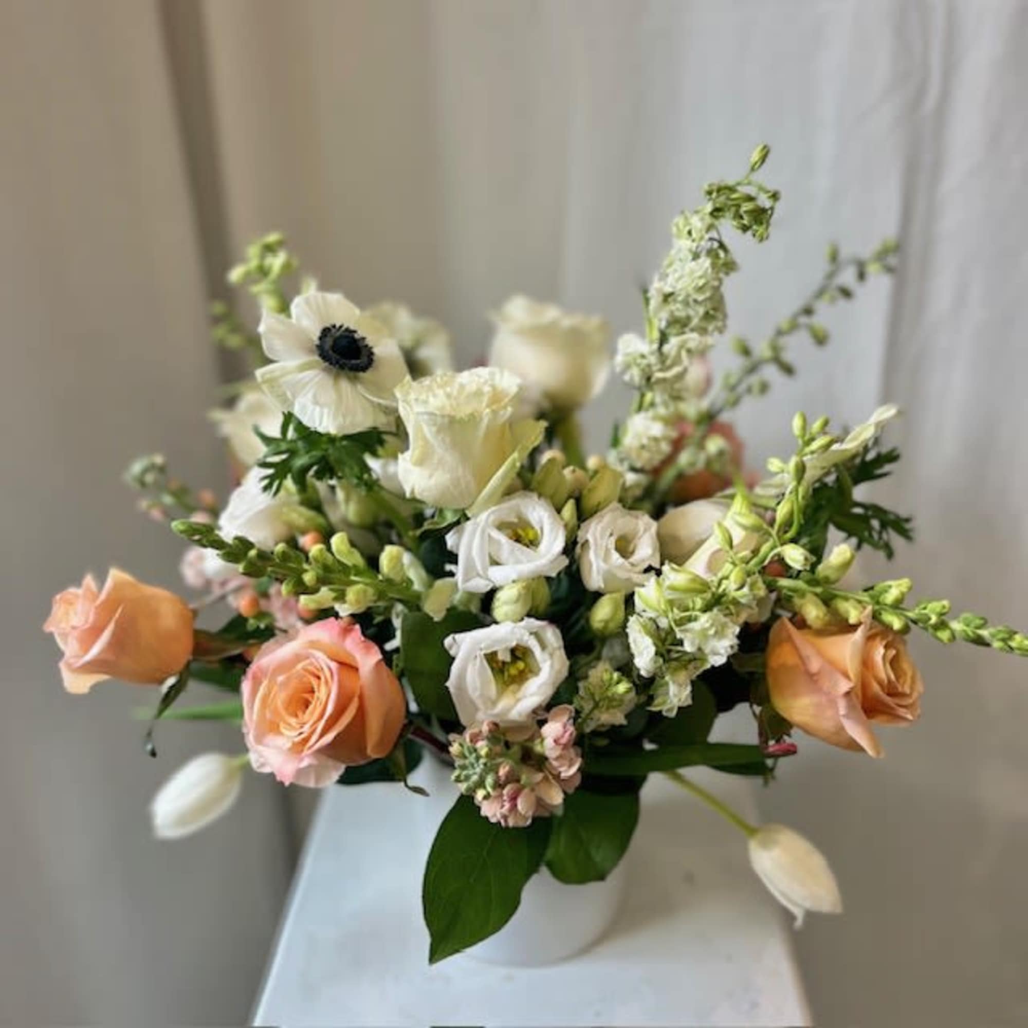 A sweet treat for the eye. This floral design features pastel pinks A sweet treat for the eye. This floral design features pastel pinks