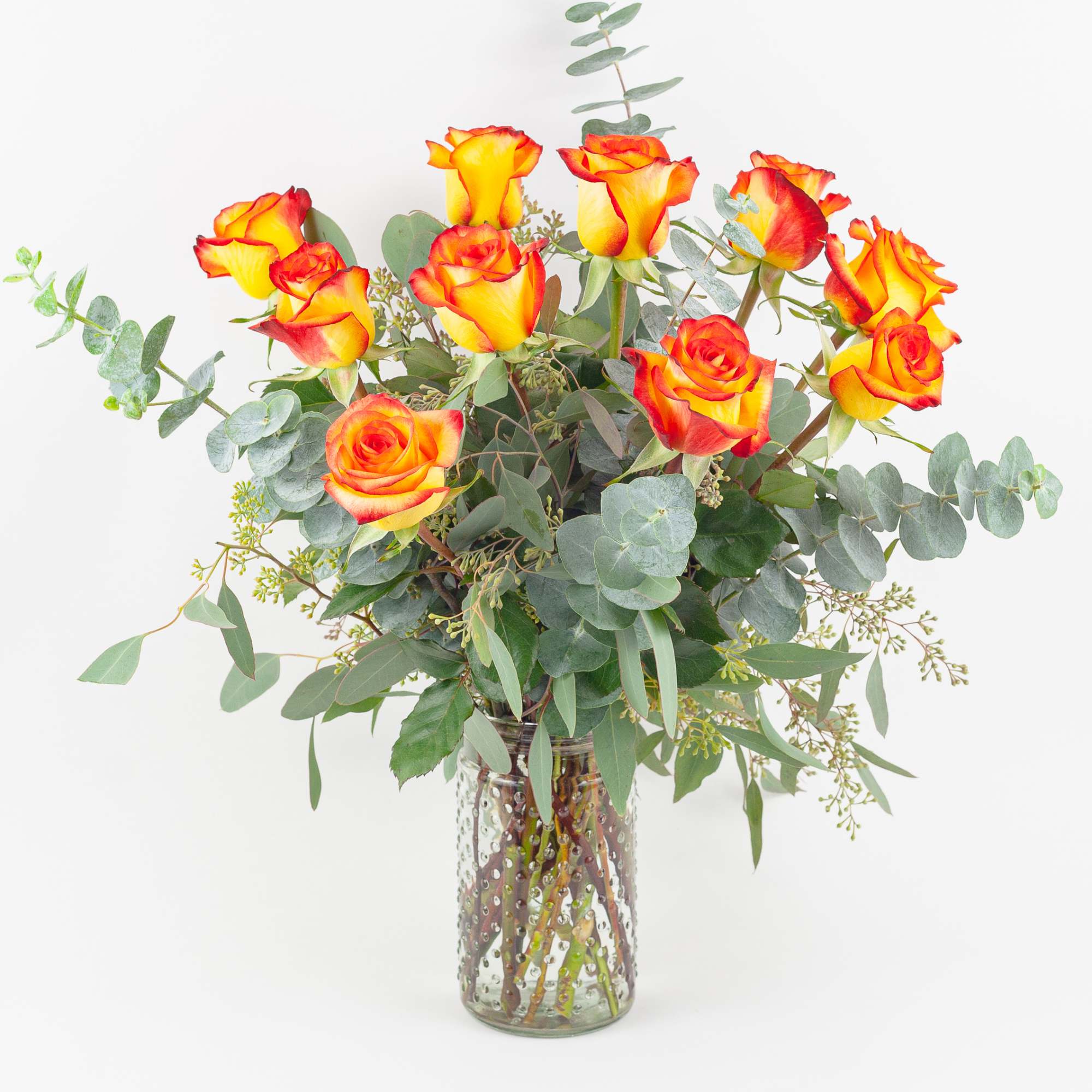 LONG STEM YELLOW ORANGE ROSES IN VASE

Fresh and lush. This beautiful glass