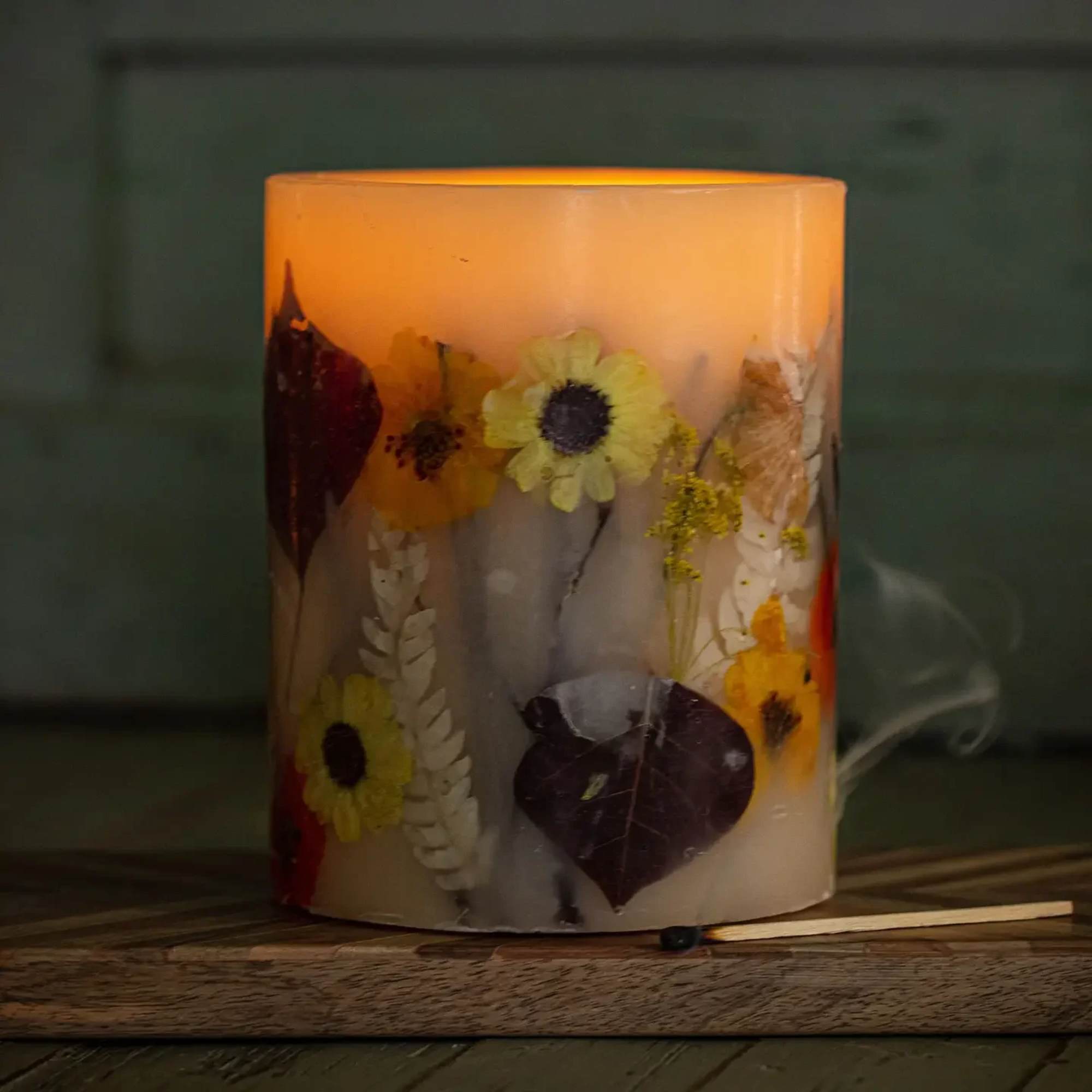 Leather-bound books, antique wood, pipe tobacco paired with a golden drizzle of