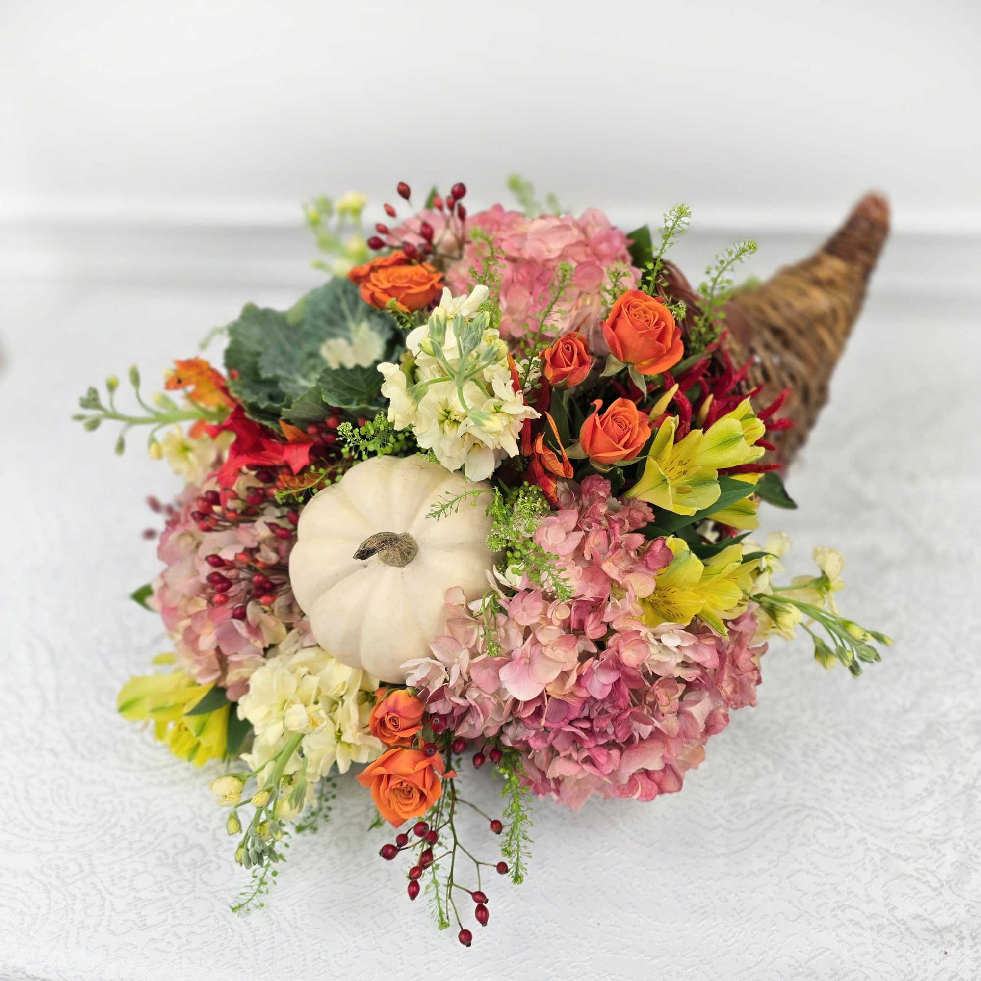 Have a festive thanksgiving this year with this classic cornucopia arrangement. 