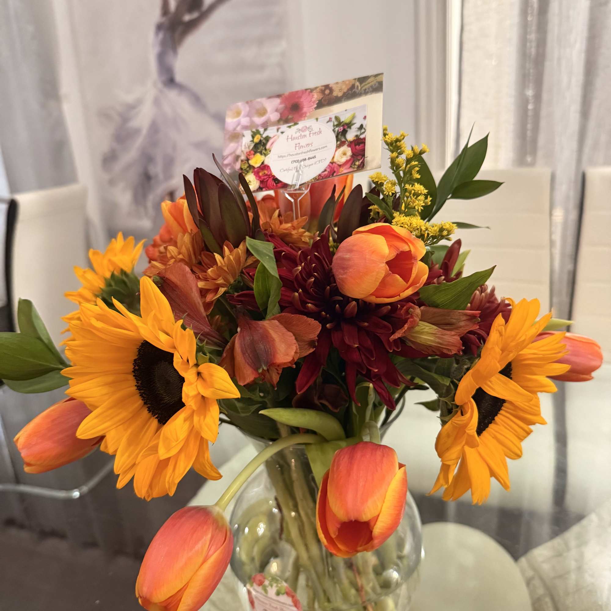 This is a vibrant fall-inspired arrangement that radiates warmth and coziness. The