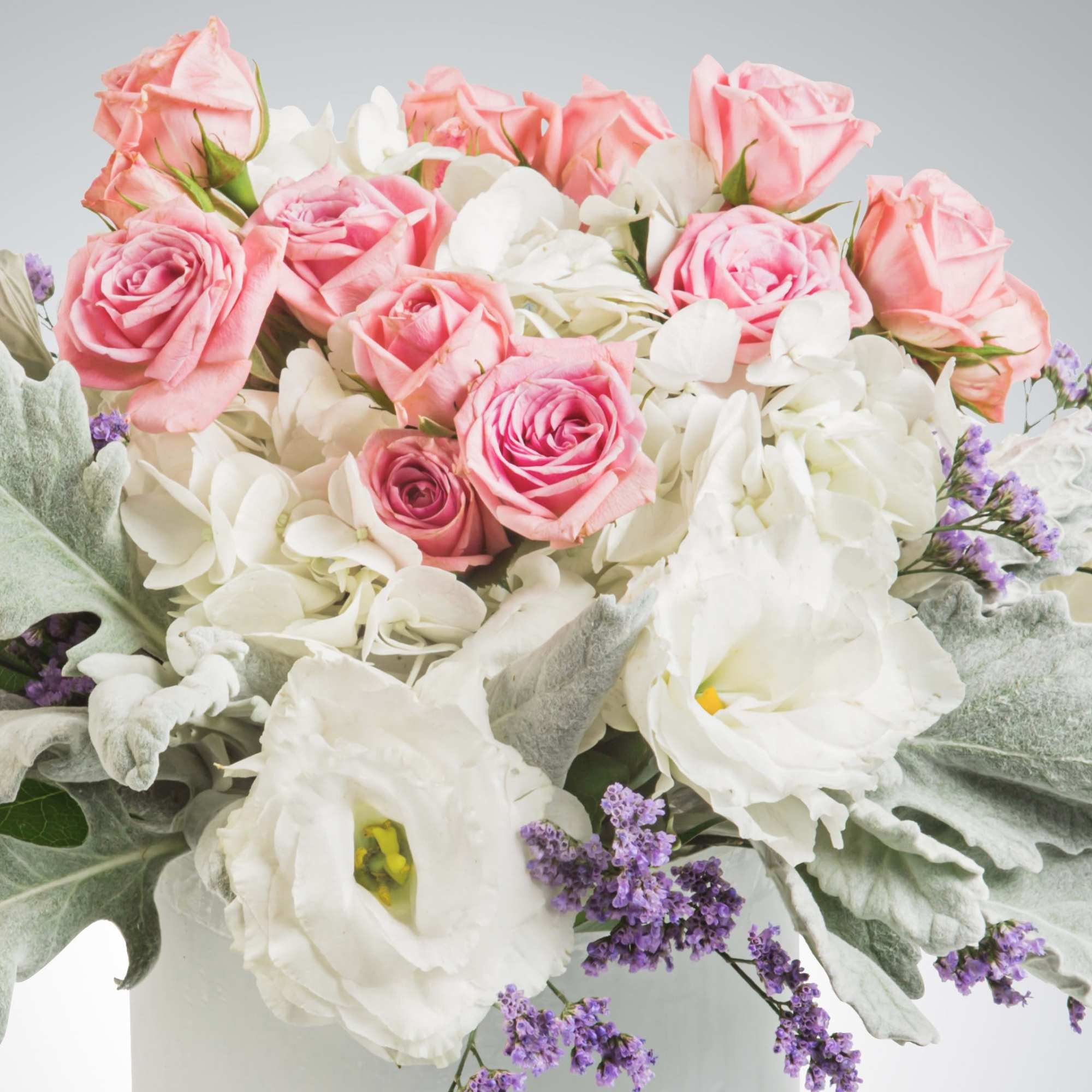 This angelic arrangement is as cute as it is pretty. Featuring the