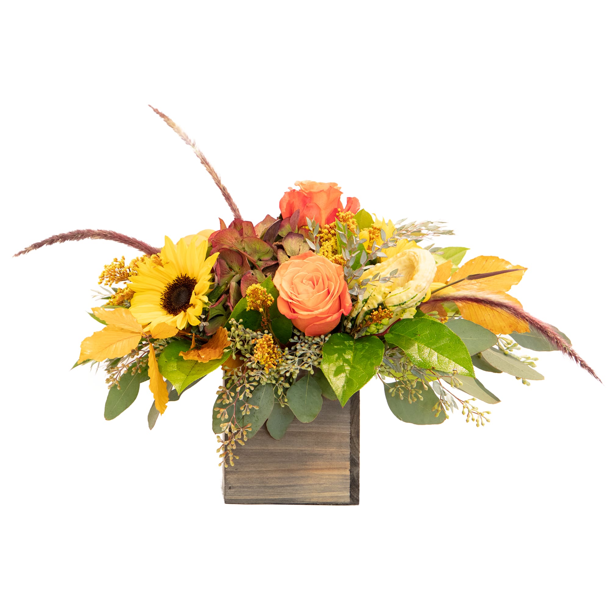 A low Fall themed arrangement filled with stunning, bright fall colors. 