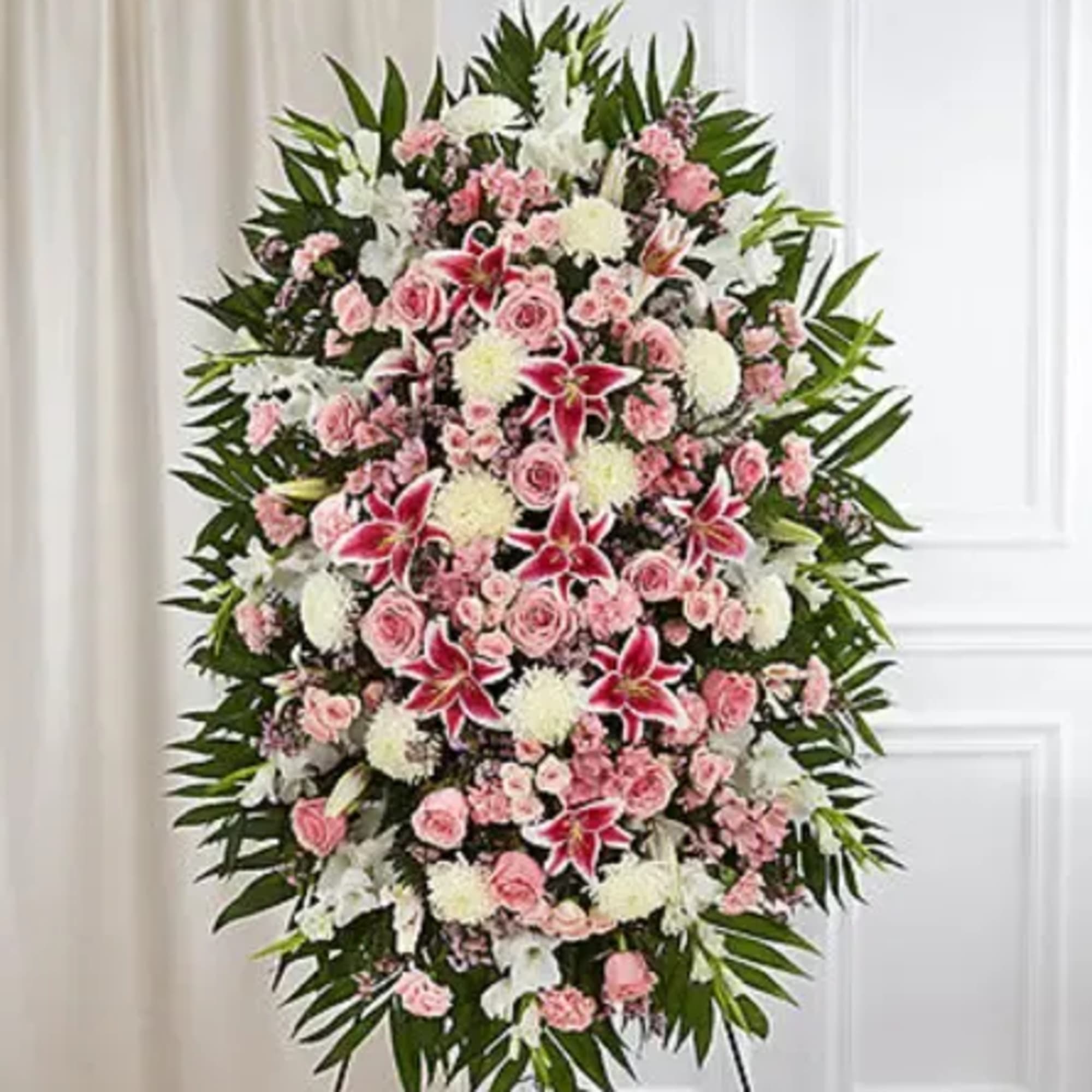 A heartfelt expression of love and remembrance, this elegant standing spray features