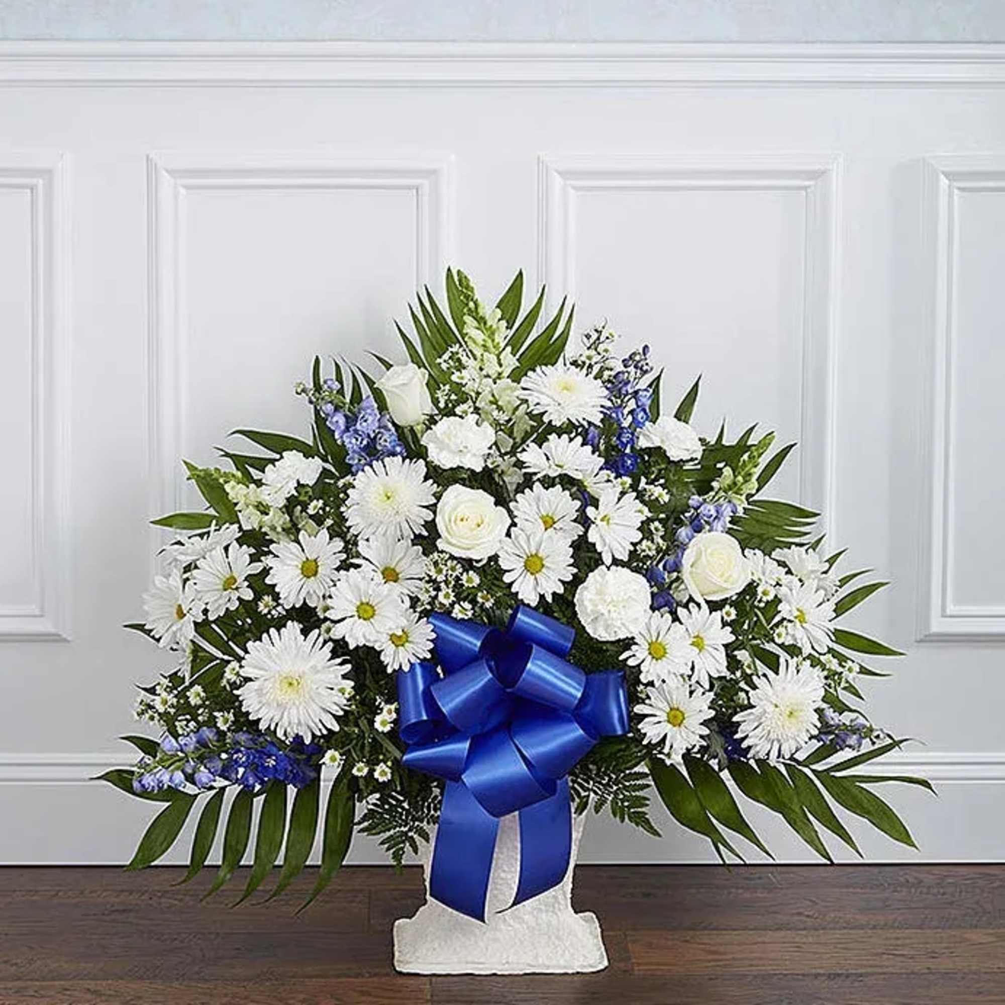 This elegant blue and white floor basket is a heartfelt expression of This elegant blue and white floor basket is a heartfelt expression of
