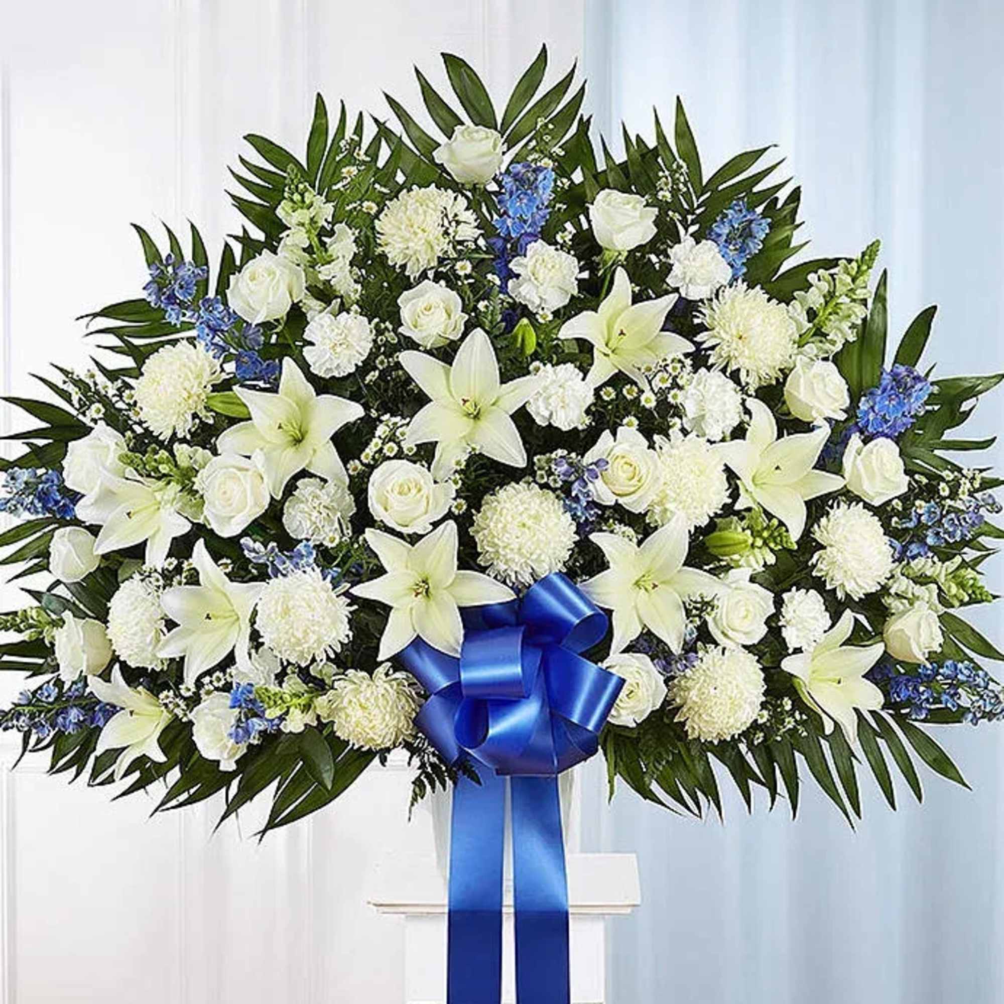 Graceful and serene, this elegant blue and white standing basket is a
