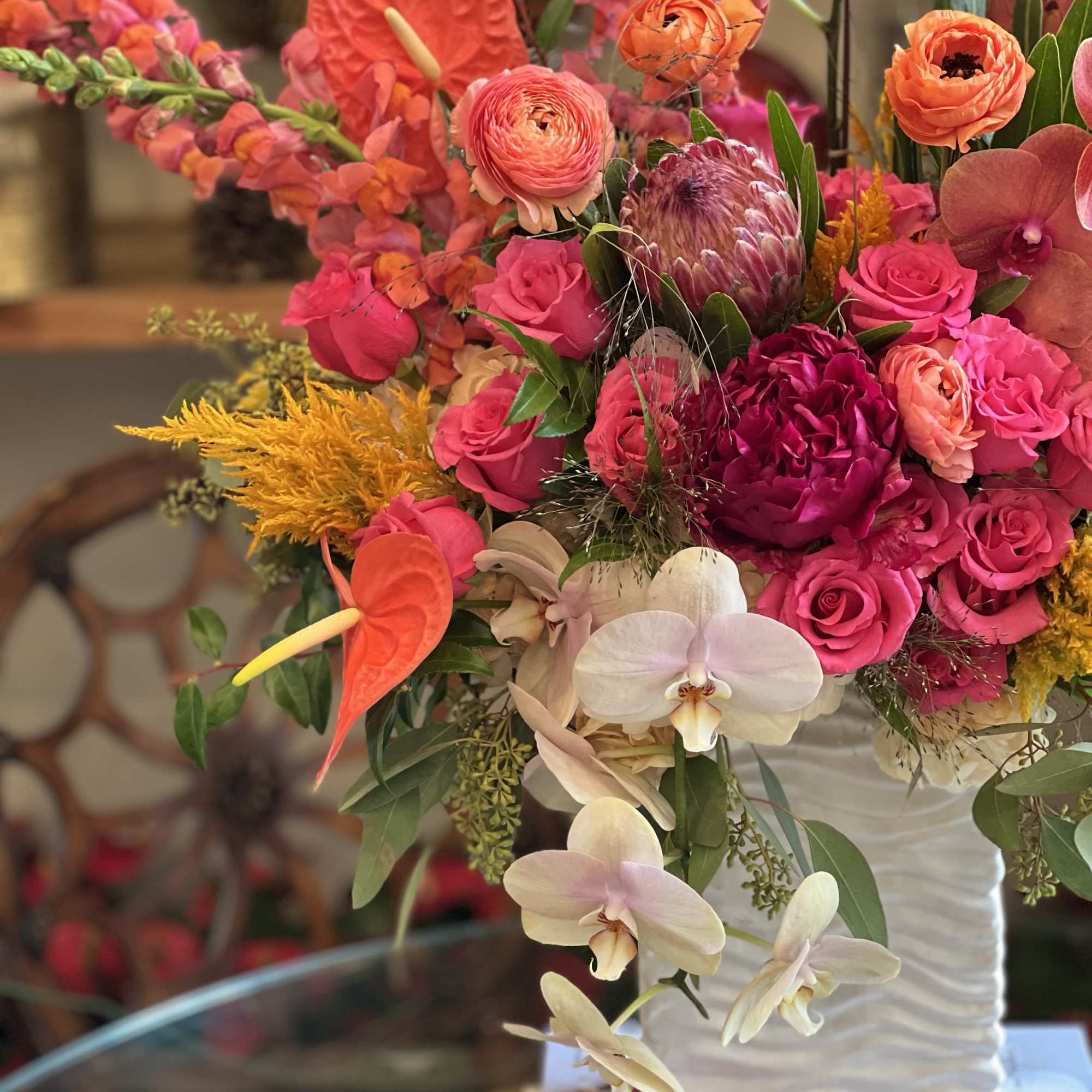 Flowers: tangy red anthuriums, hot pink spray roses, orange snapdragons, peach and Flowers: tangy red anthuriums, hot pink spray roses, orange snapdragons, peach and