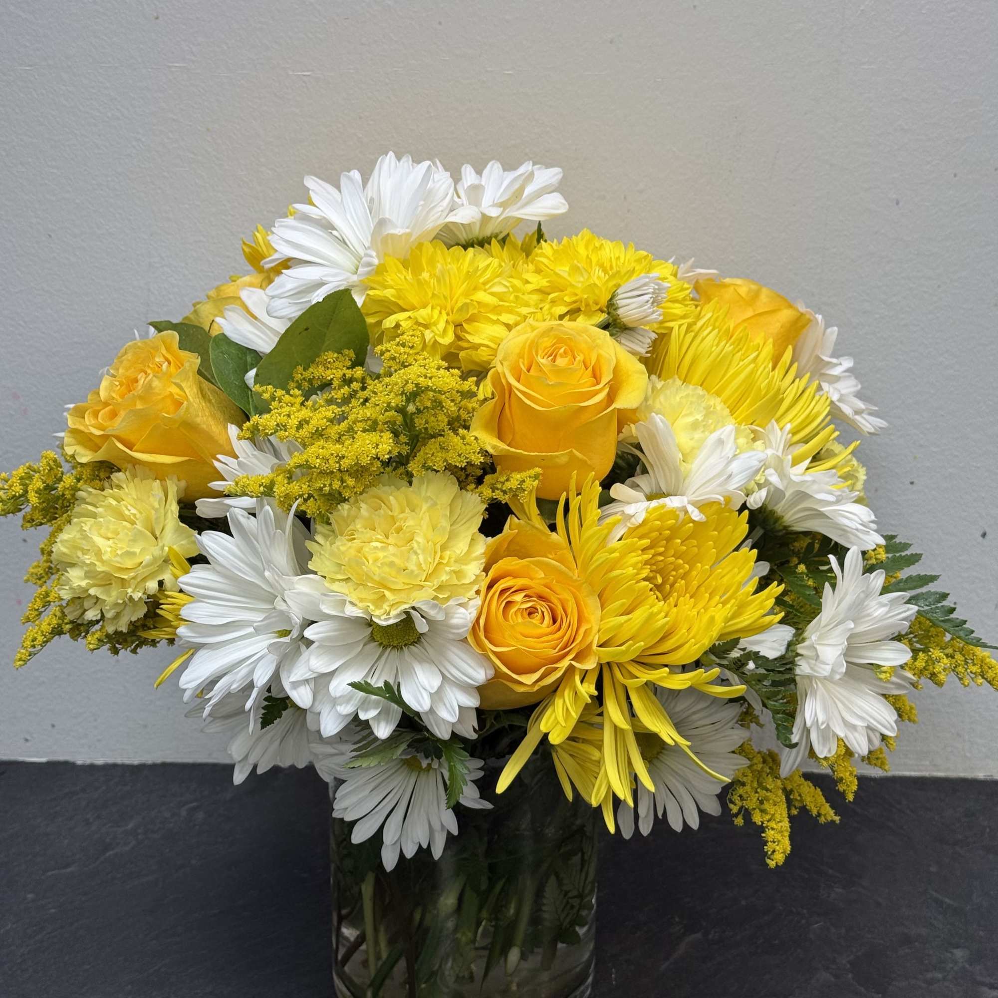 Brighten any room with this cheerful mix of golden yellow roses, sunny
